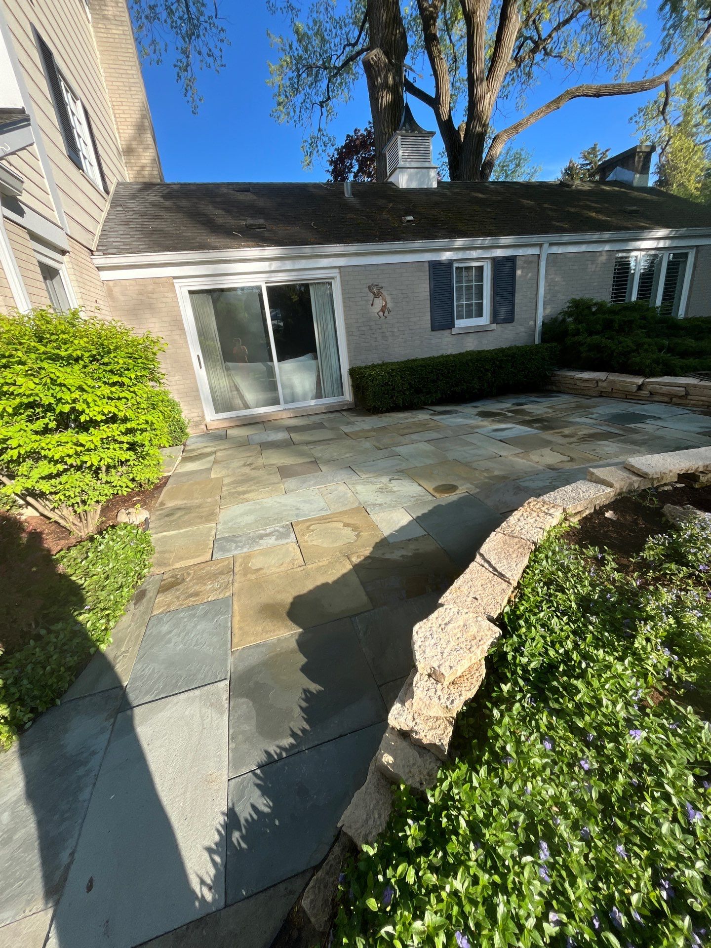 natural stone using Algaecide, soft wash soap by Northern Power Washing LLC.