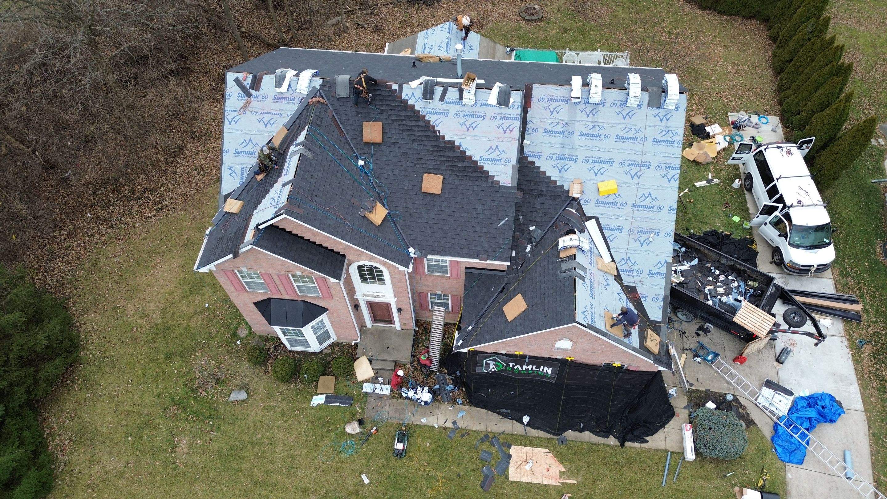 Walden Ponds - Pristine Black and Hydro Flo Gutter Guards by Tamlin Roofing