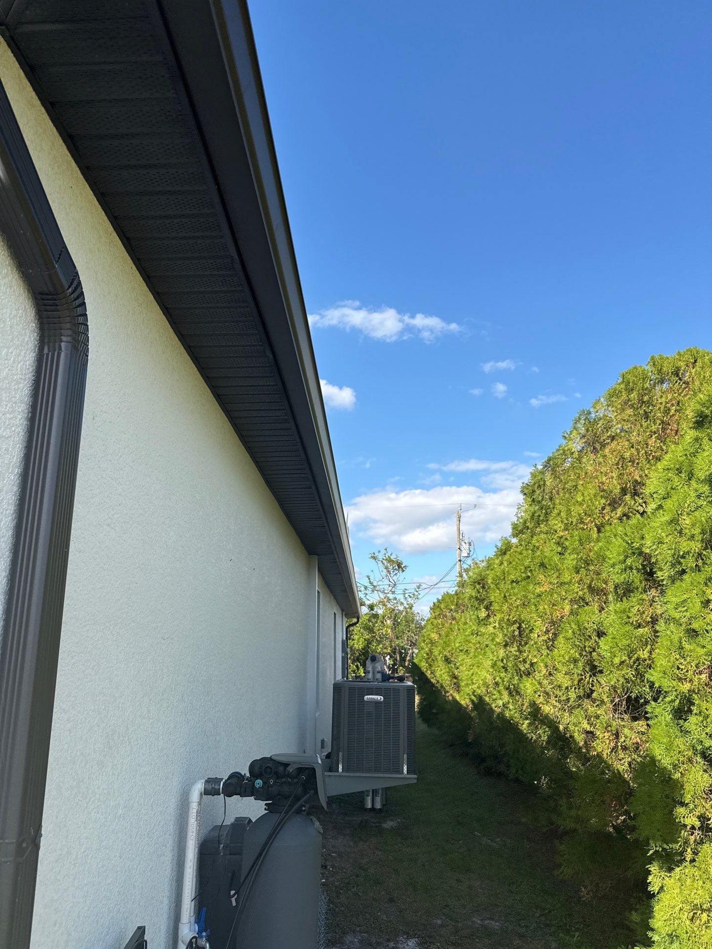Dark Seamless Gutters and Downspouts in Cape Coral FL by Gutter Professors