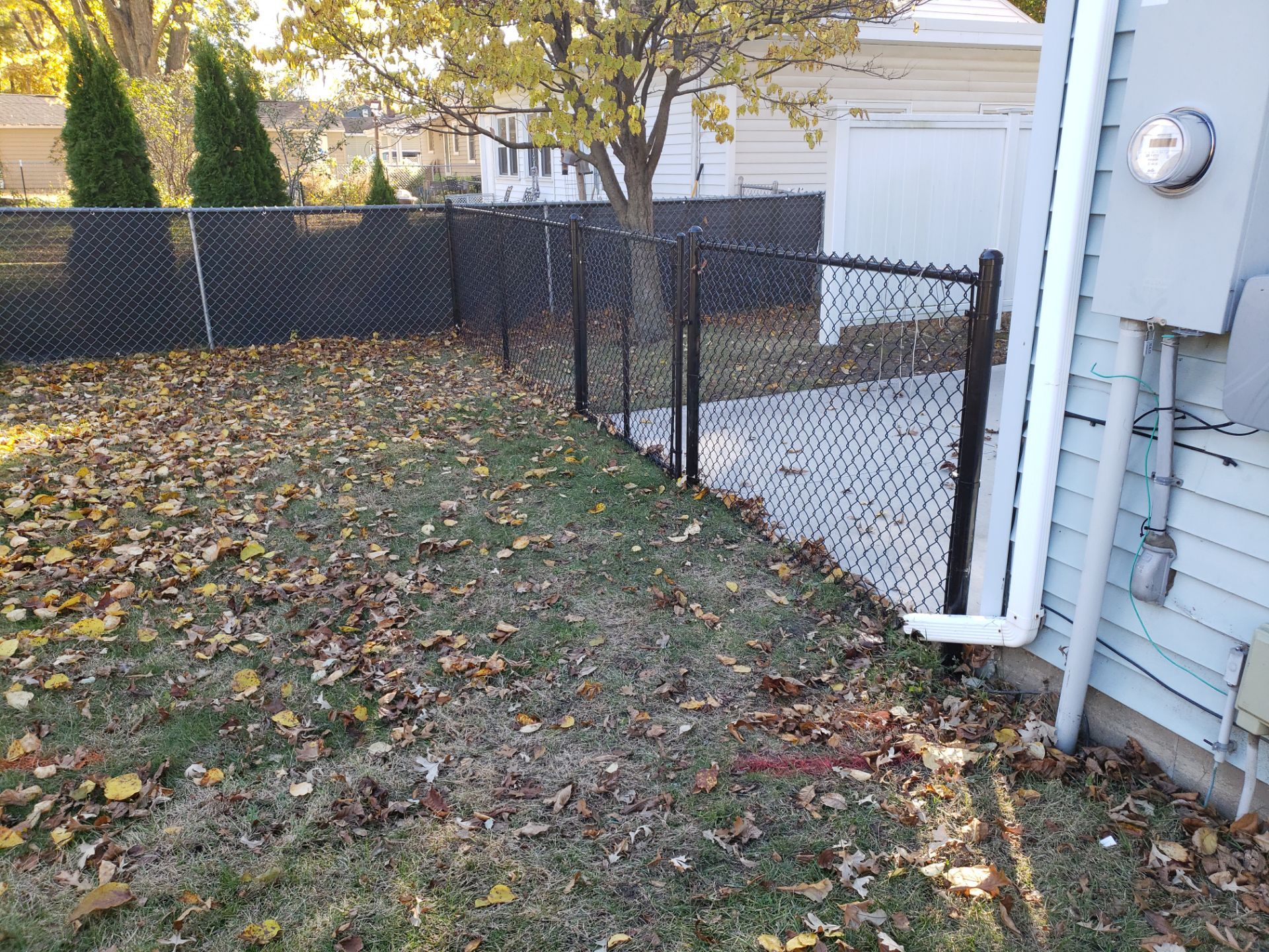 Black Chain Link Fence Installation in Cedar Falls, Iowa by Perfect Picket Fence and Stain