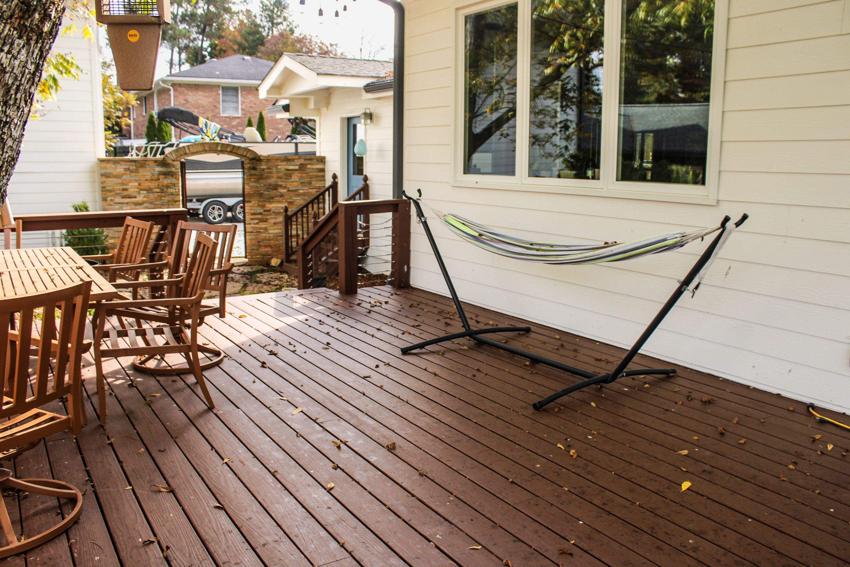 Deck Resurface with Glass Paneling and Deckorators Voyage Series Products by Nelson Exteriors 