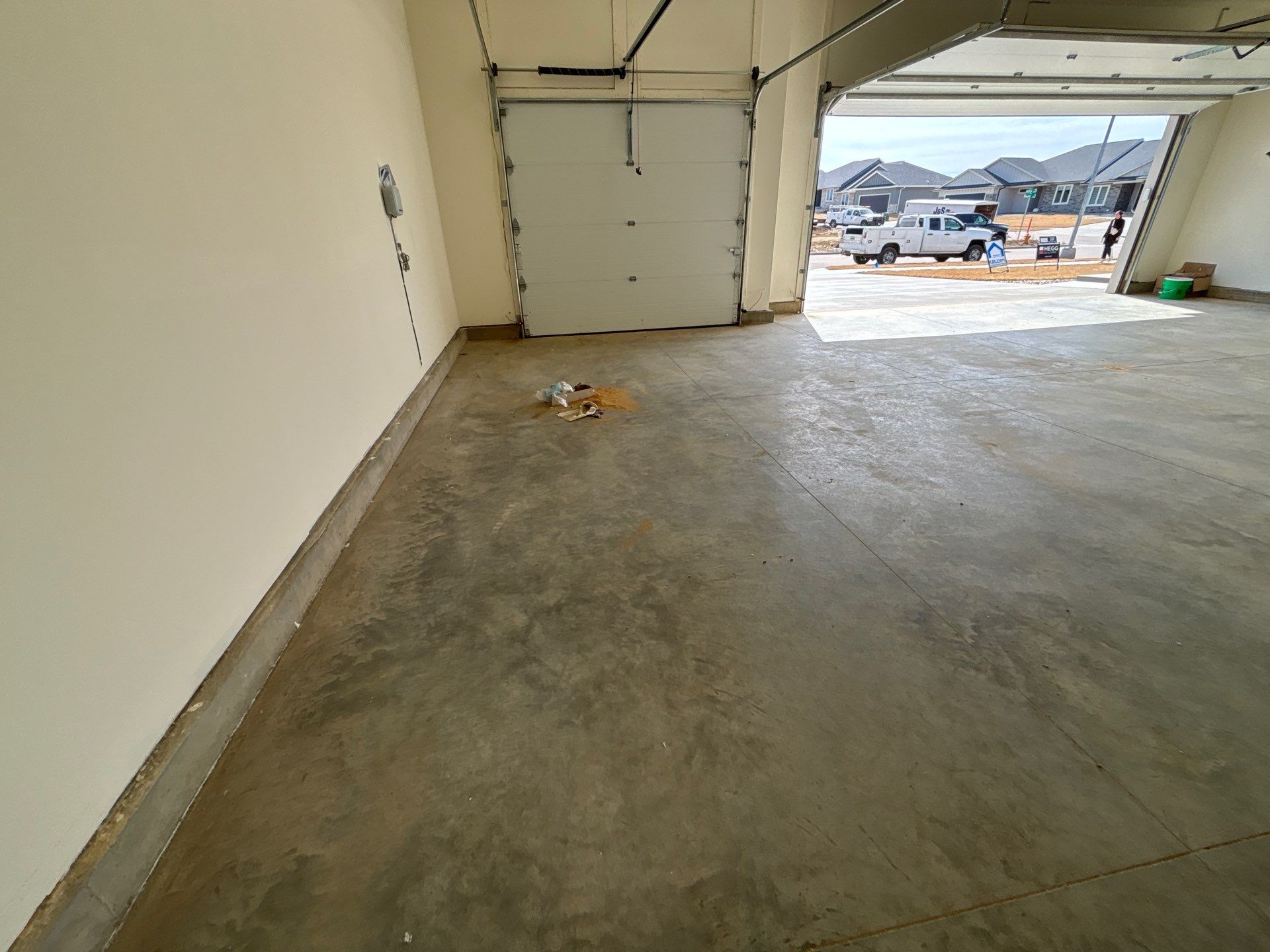 Sioux Falls Garage Floor Transformation with Gray Decorative Flake Coating by Select Painting, Coatings & Garage Cabinets