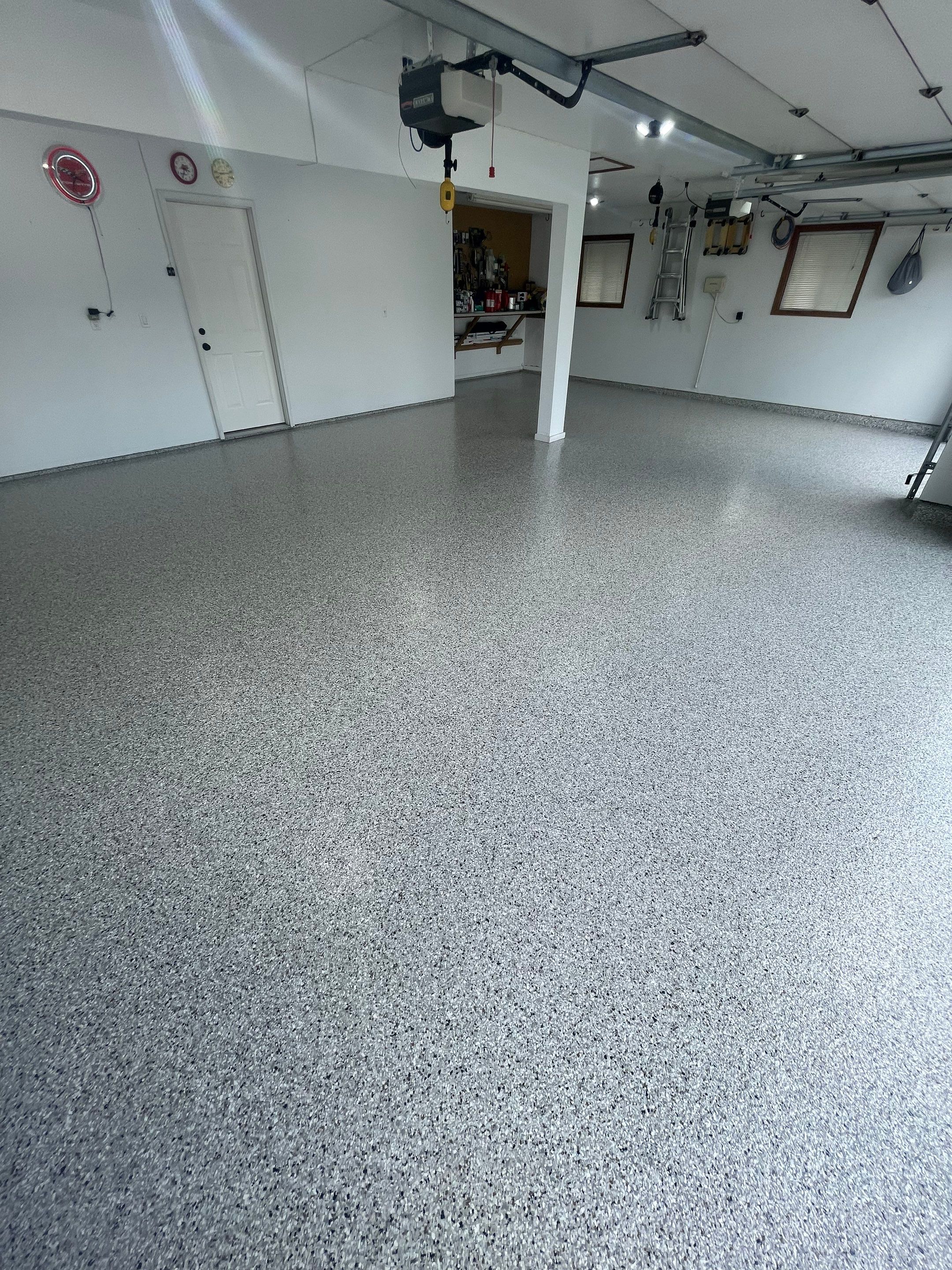 Multi-Car Garage Concrete Coating with Coyote Flake Finish in Sioux Falls by Select Painting, Coatings & Garage Cabinets