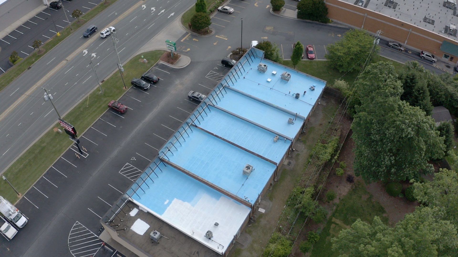 Commercial Roof Coating using Fiberseal basecoat and Silicon Topcoat by Just In Time Roofing and Restoration