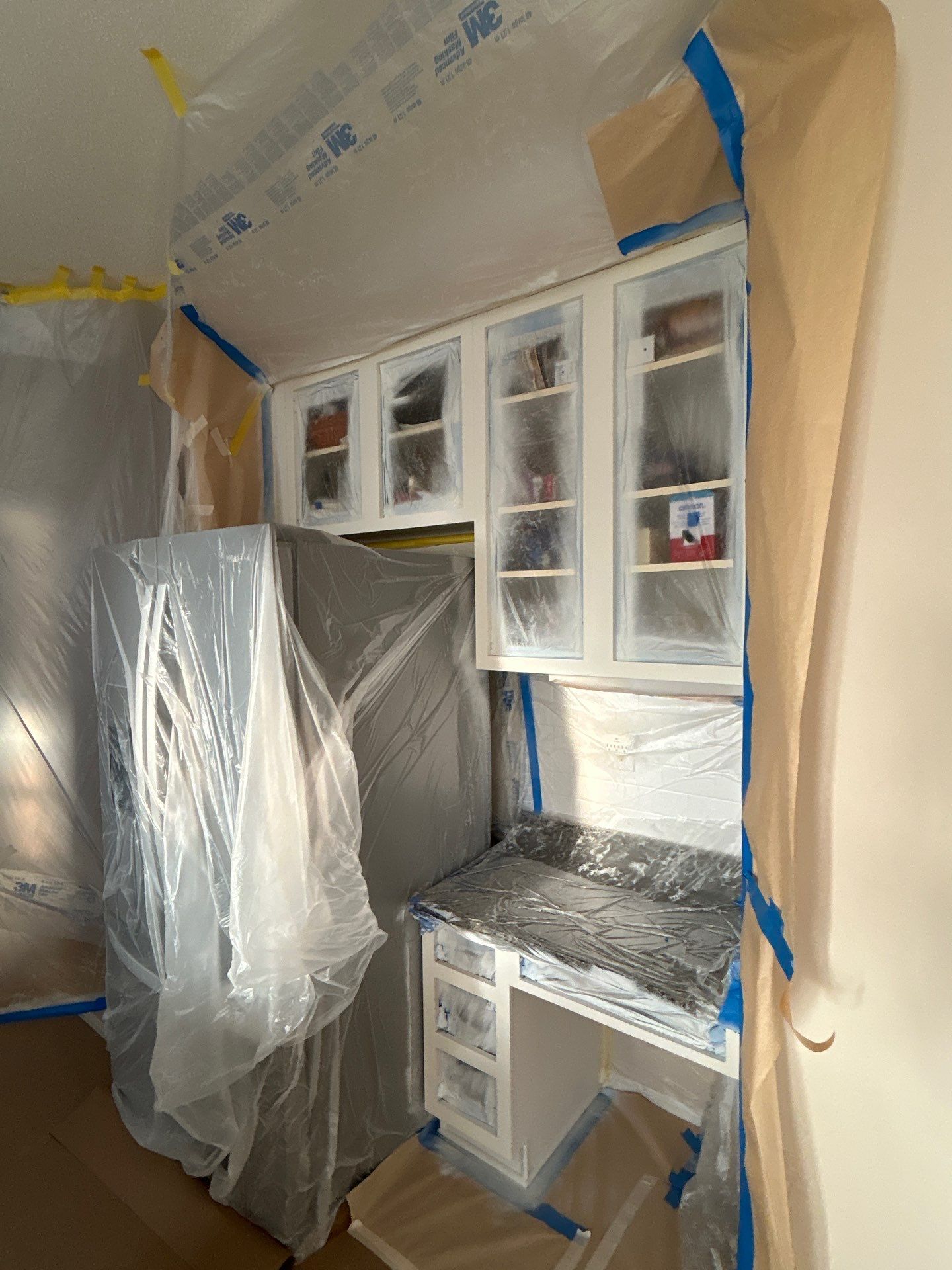 Cabinet painting by GonzalezPainters & Contractors Inc 