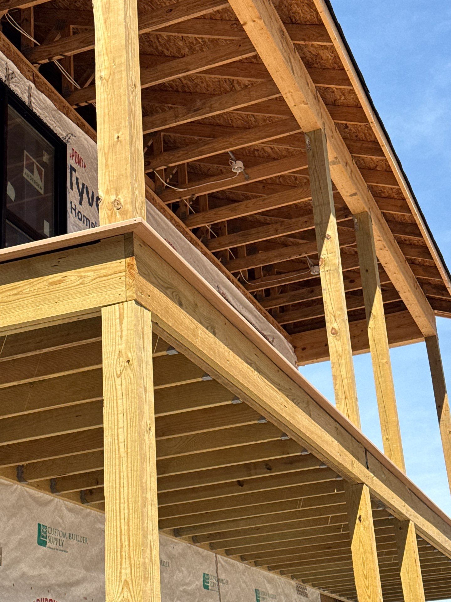 Two-Story Custom Home With Board and Batten Siding by Cade Construction