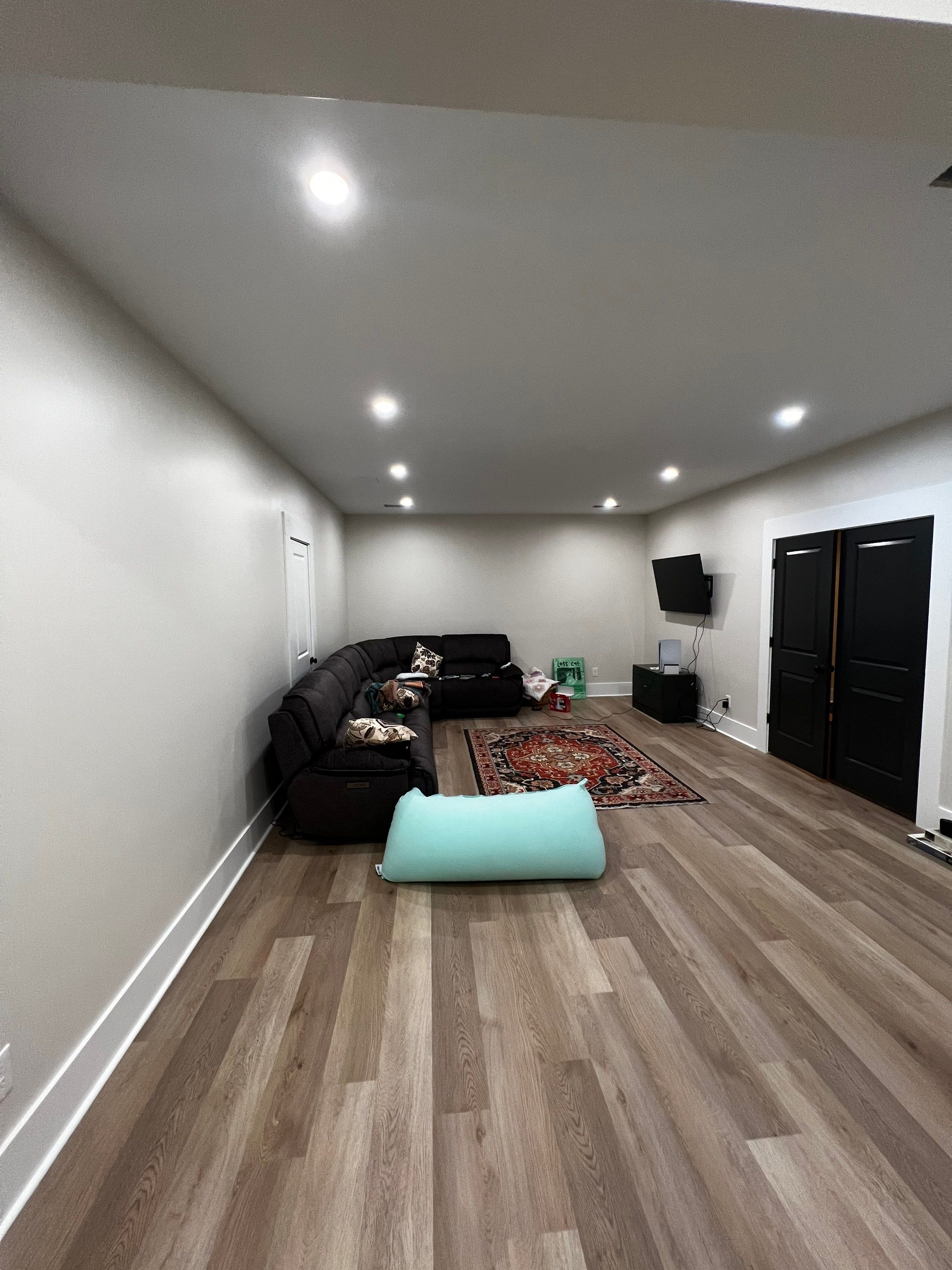 Basement Remodeling With New Bathroom and Luxury Vinyl Flooring by Swift Home Renovations