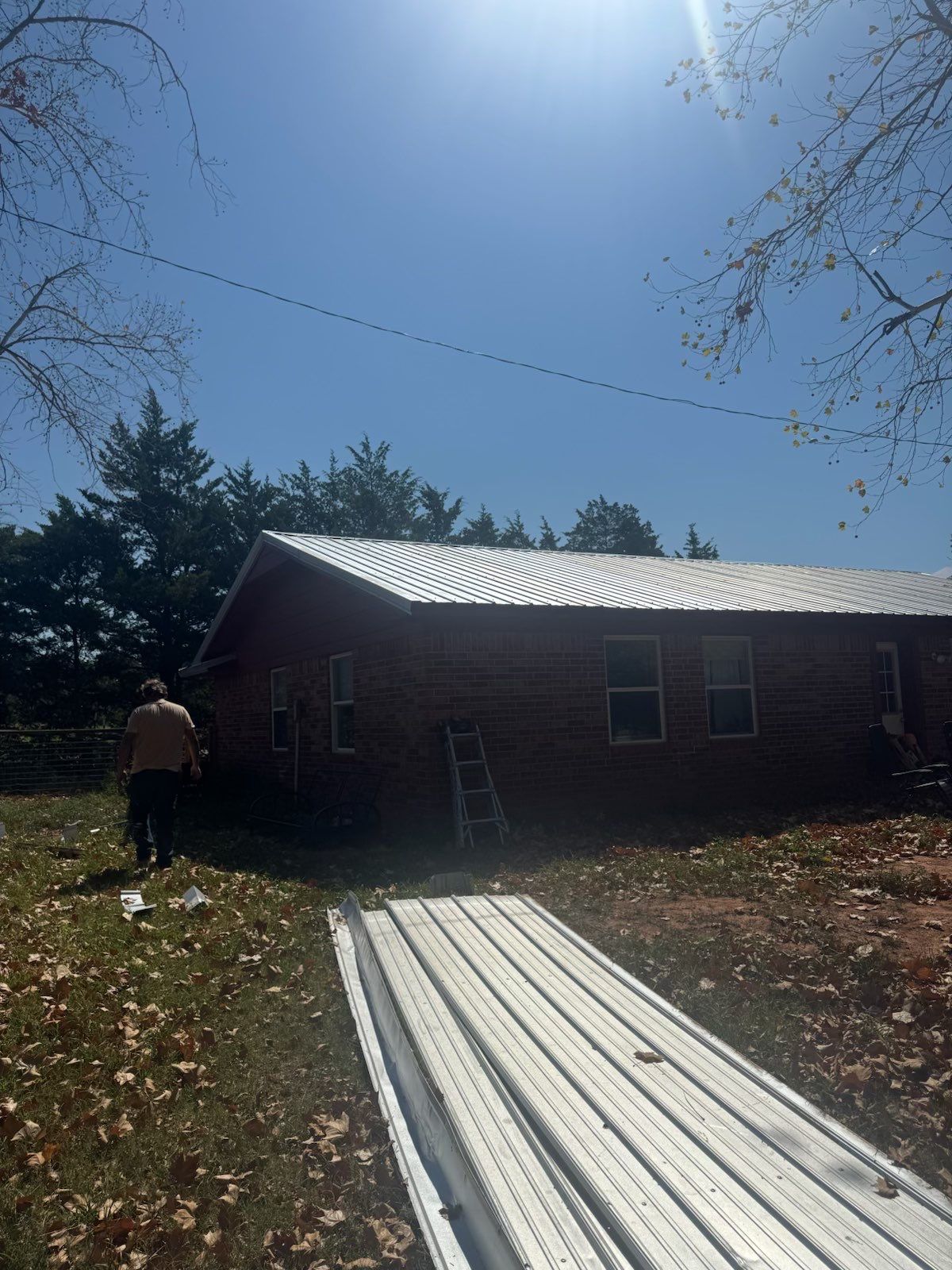Corrugated Metal Roof Repair for Brick Home in Lindsay by BANA Roofing and Solar Supply