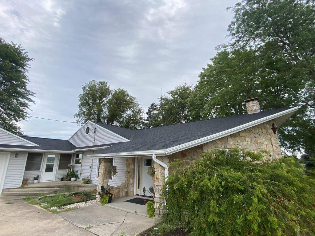 Storm damage roof replacement by Nitro Roofing and Construction