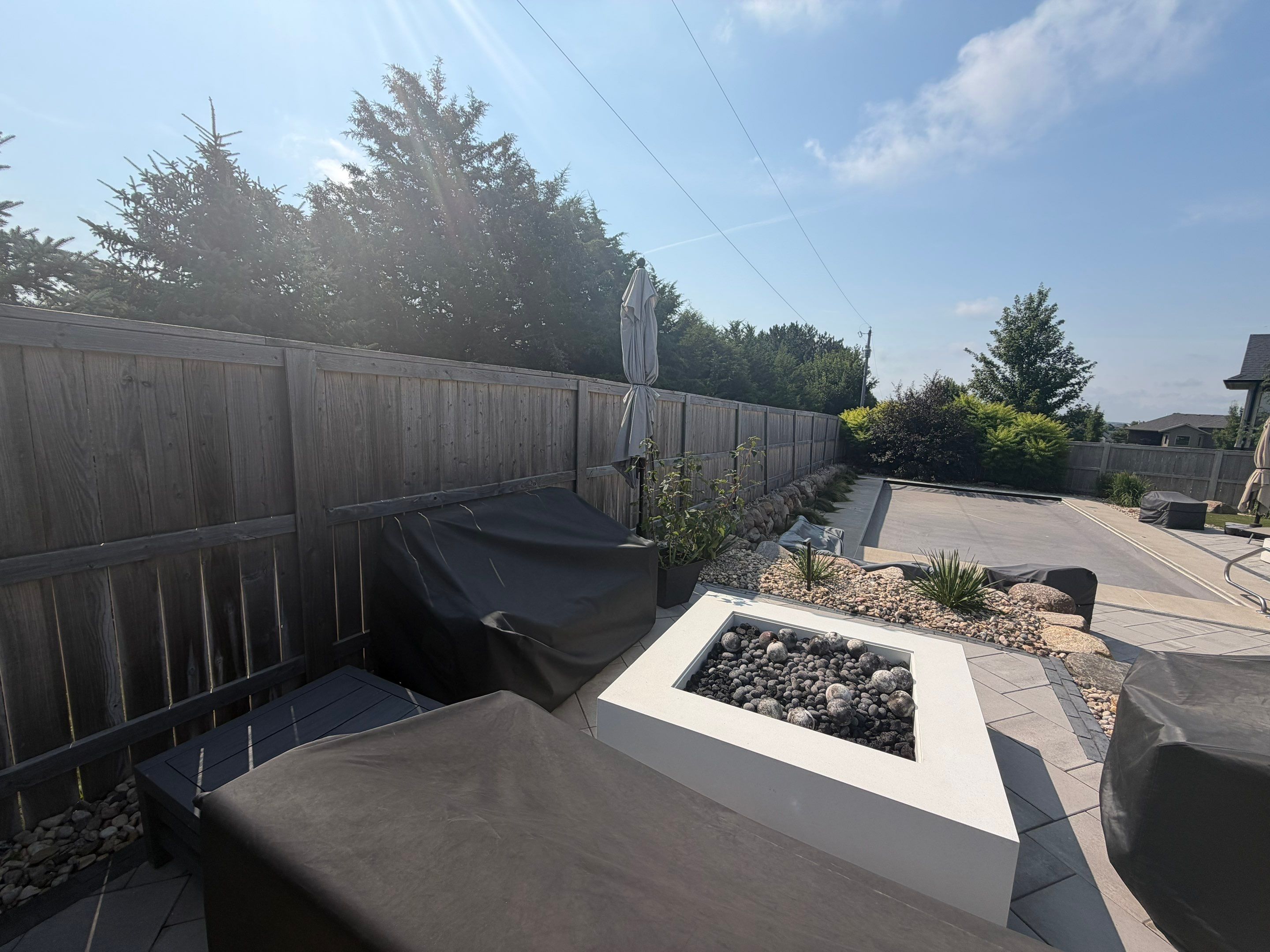 Custom Privacy Fence and Paver Patio Installation in Sioux Falls by Select Painting, Coatings & Garage Cabinets