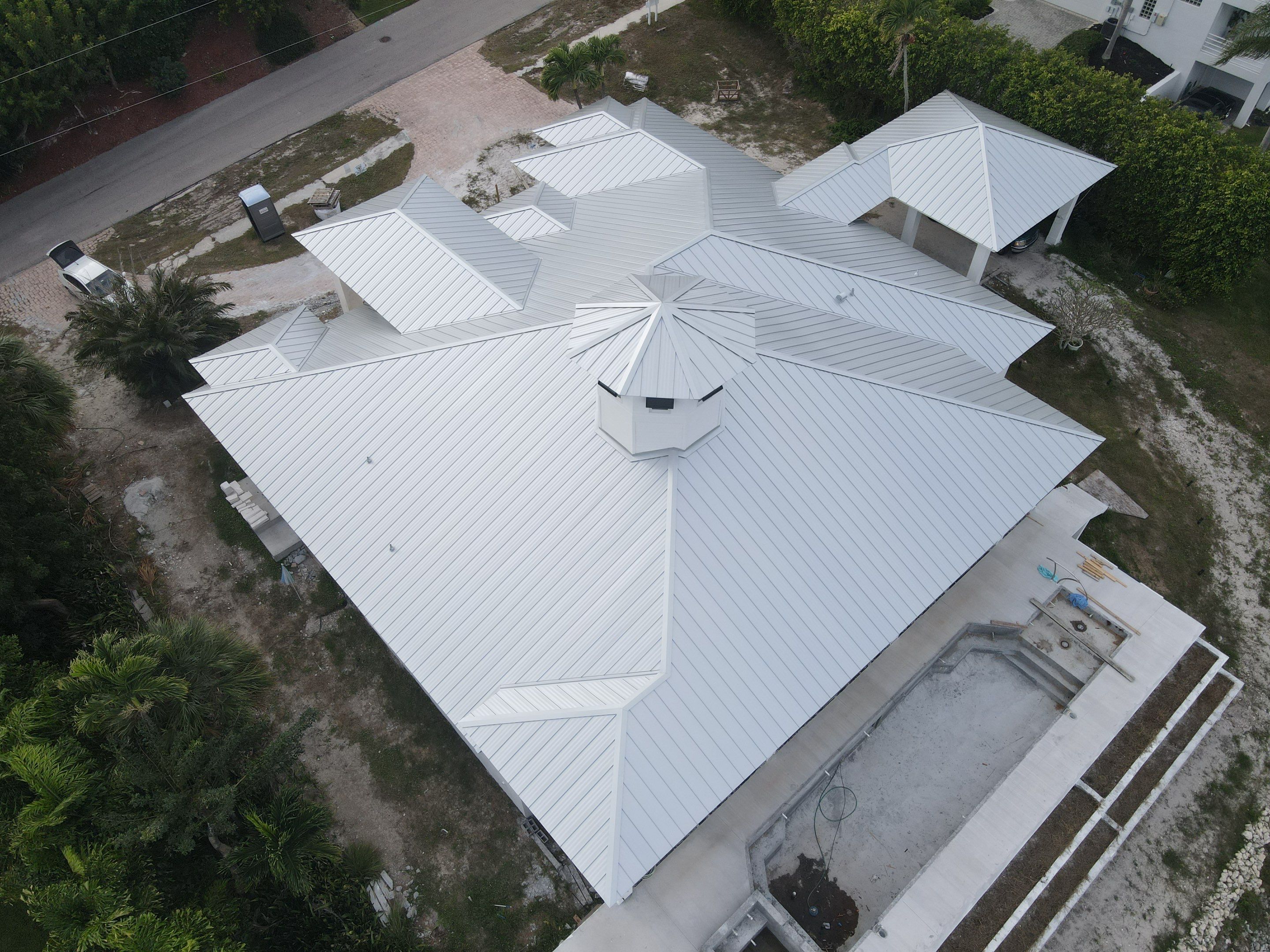Residential Roofing Installation using Galvalume Standing Seam by Durabilis Roofing INC