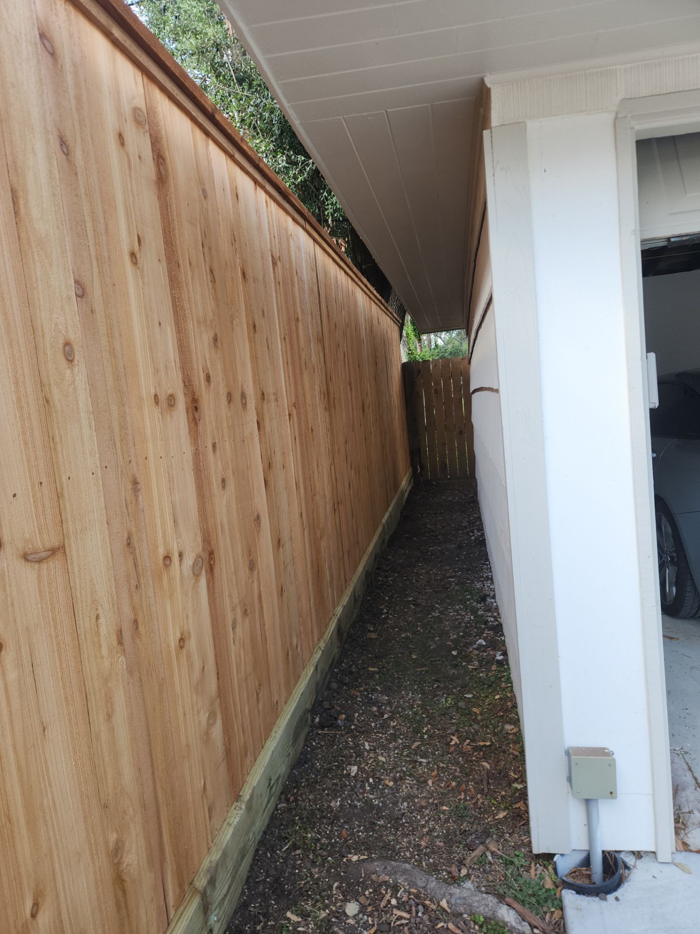 8ft Tall wood fence installation by Tim's Fences