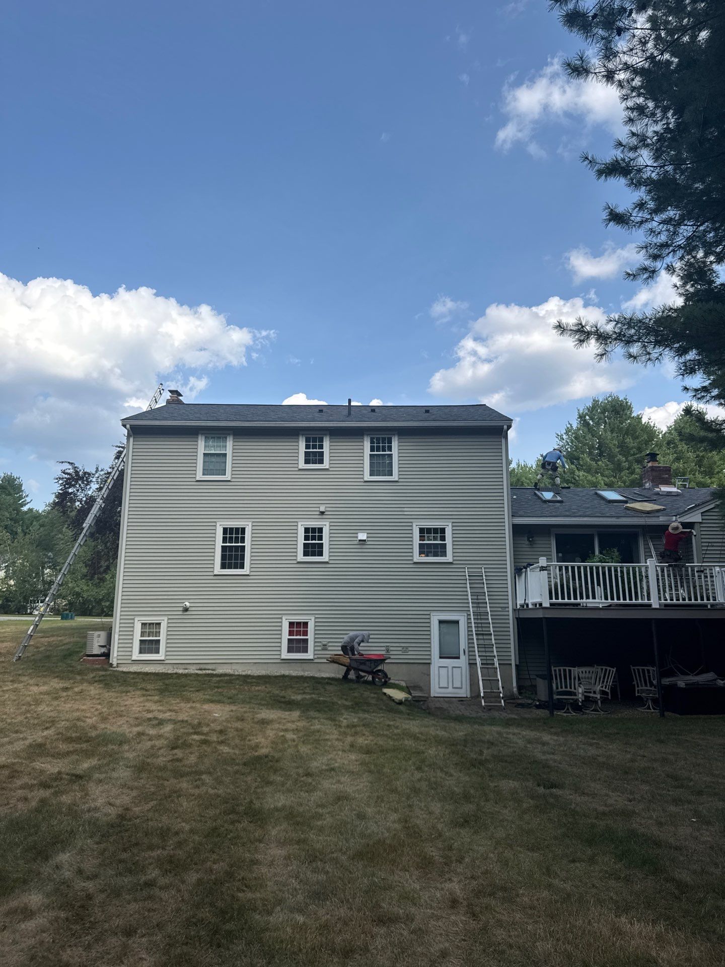 Complete Roof Replacement with Chimney Flashing, Gutter Guard System, and Vinyl Siding Repairs by Mighty Dog Roofing of Greater Middlesex County