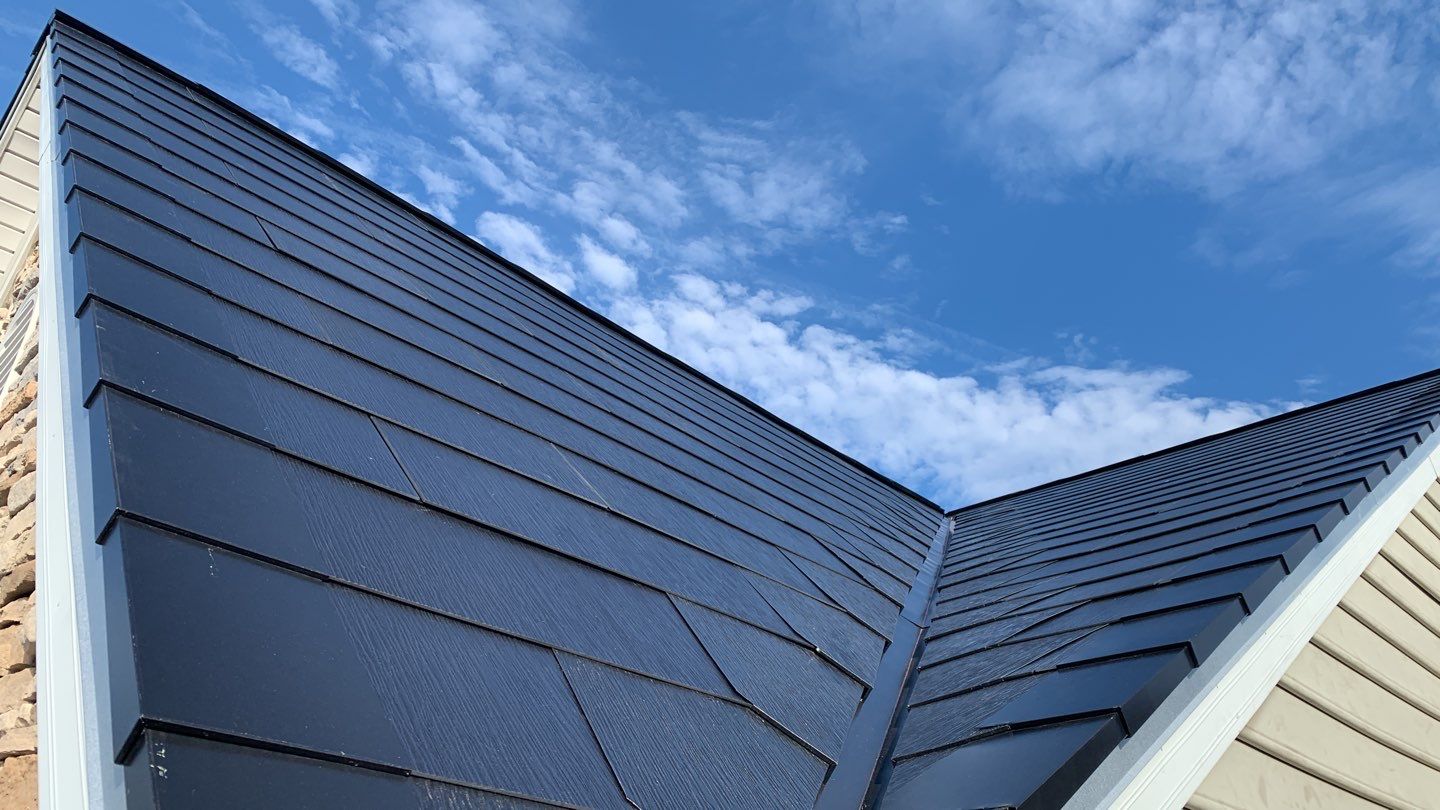 Tesla Solar Roof and Gutter Installation by American Home Contractors