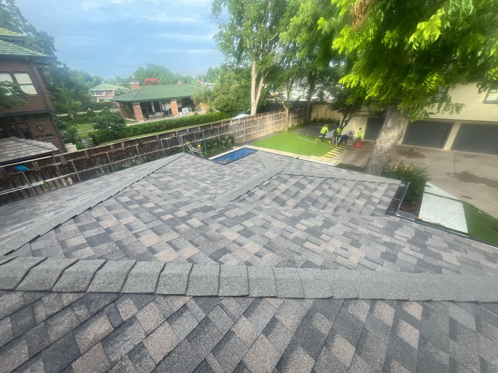 Tan exterior with IKO Driftshake by Tejas Roofworks + Restoration