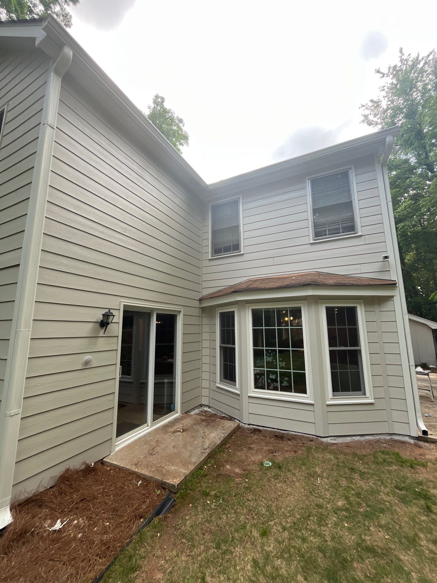 Atlanta, GA Rotten Wood Replacement, James Hardie Siding Install, Exterior Painting, and Door Replacement by Nelson Exteriors 