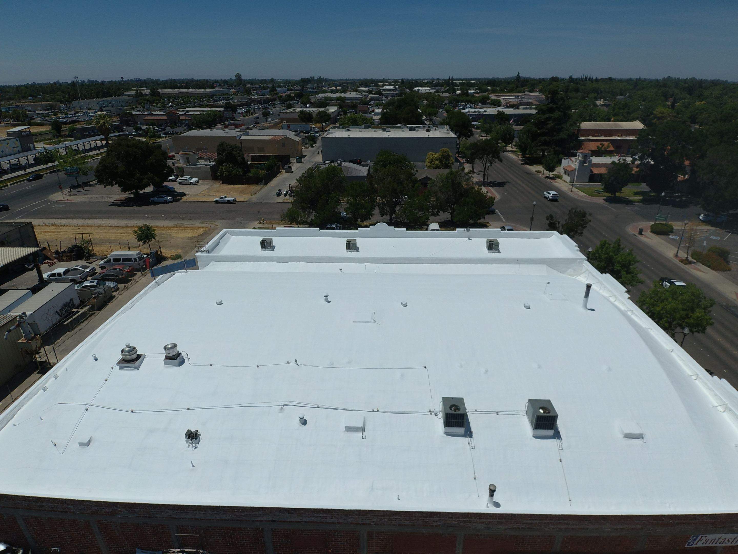 Spray foam and coatings using Conklin Benchmark/PUMA XL coatings and spray foam by Straight Edge Roofing Inc