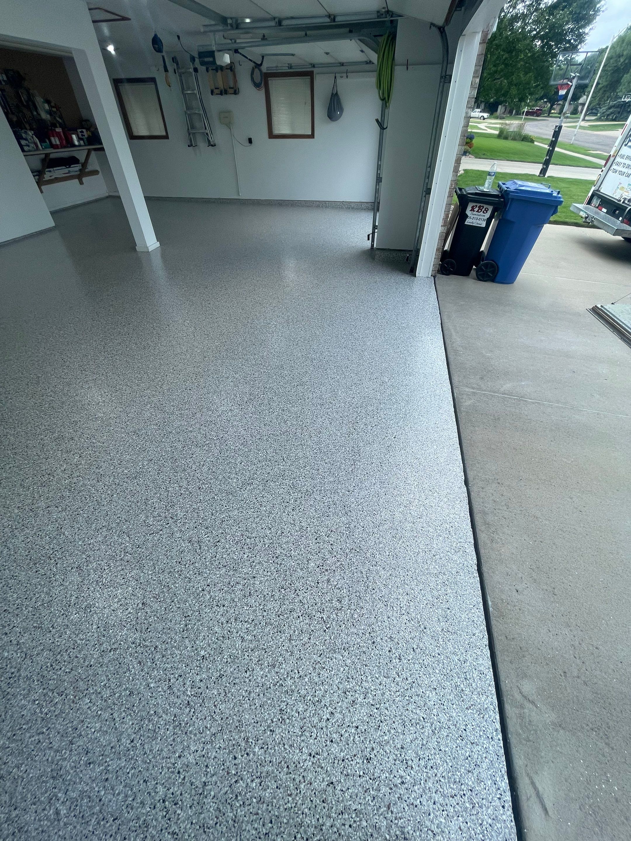 Multi-Car Garage Concrete Coating with Coyote Flake Finish in Sioux Falls by Select Painting, Coatings & Garage Cabinets