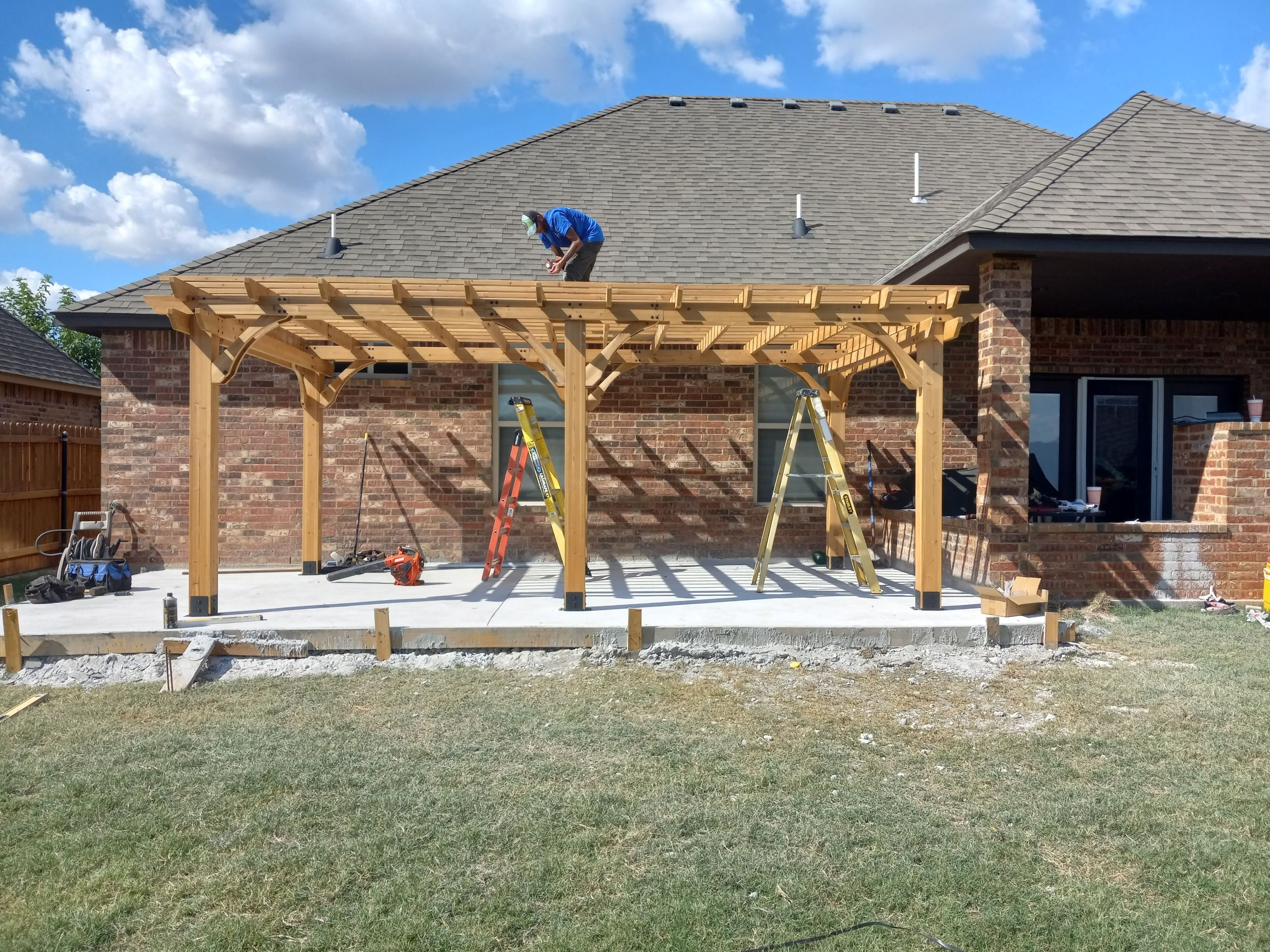 Concrete slab with Pergola by Clays Services Inc