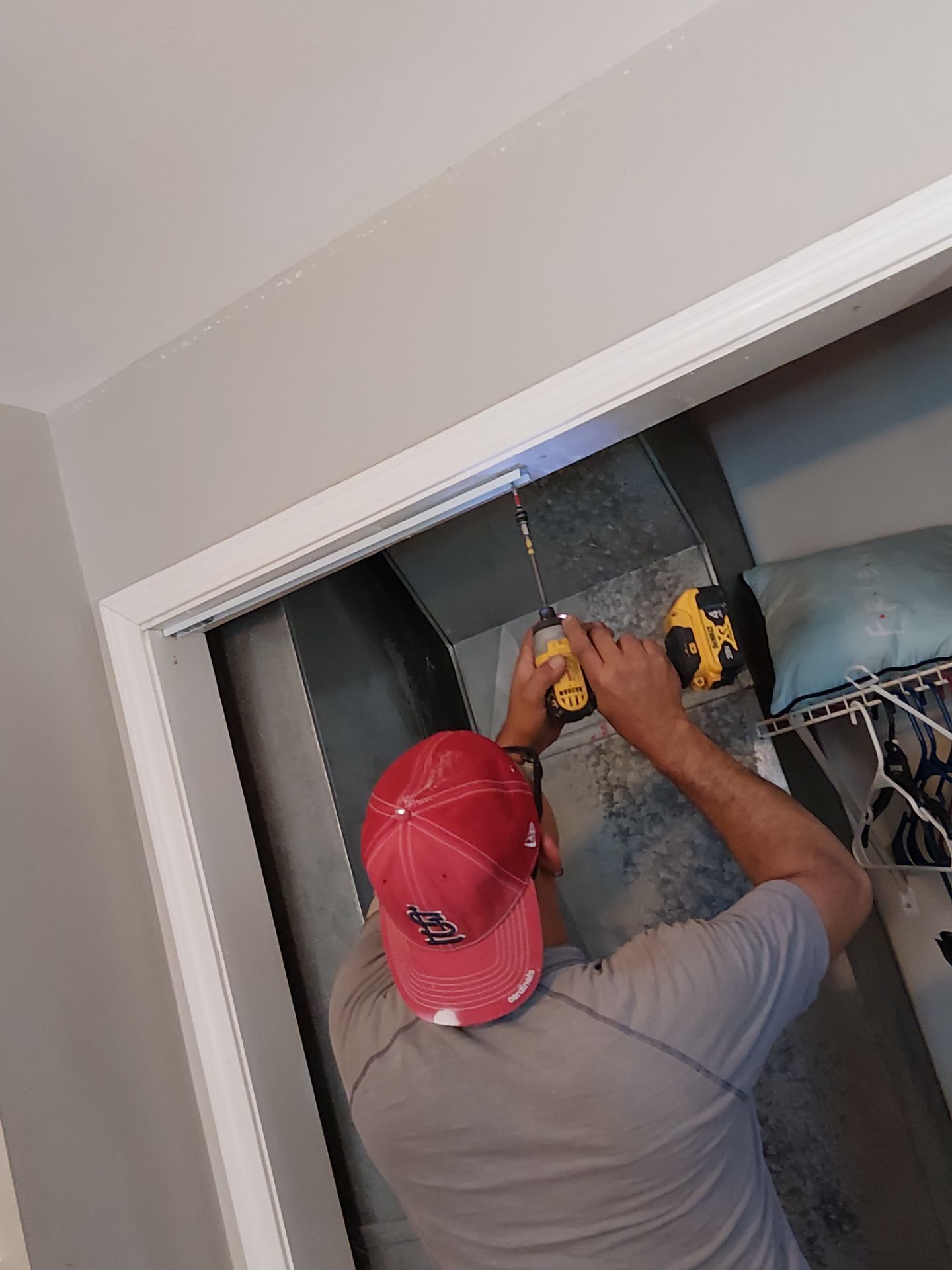 White Paneled Bifold Closet Door Installation by Legendary Services Company LLC.