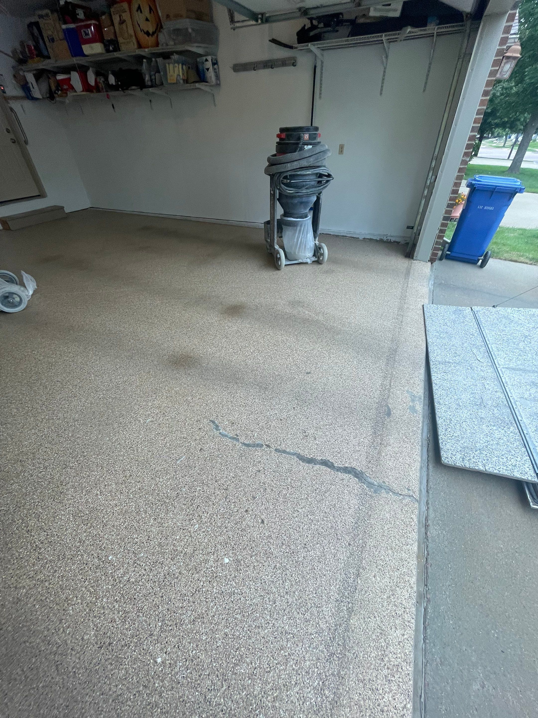 Sioux Falls Residential Garage Floor Coating with Speckled Epoxy Finish by Select Painting, Coatings & Garage Cabinets