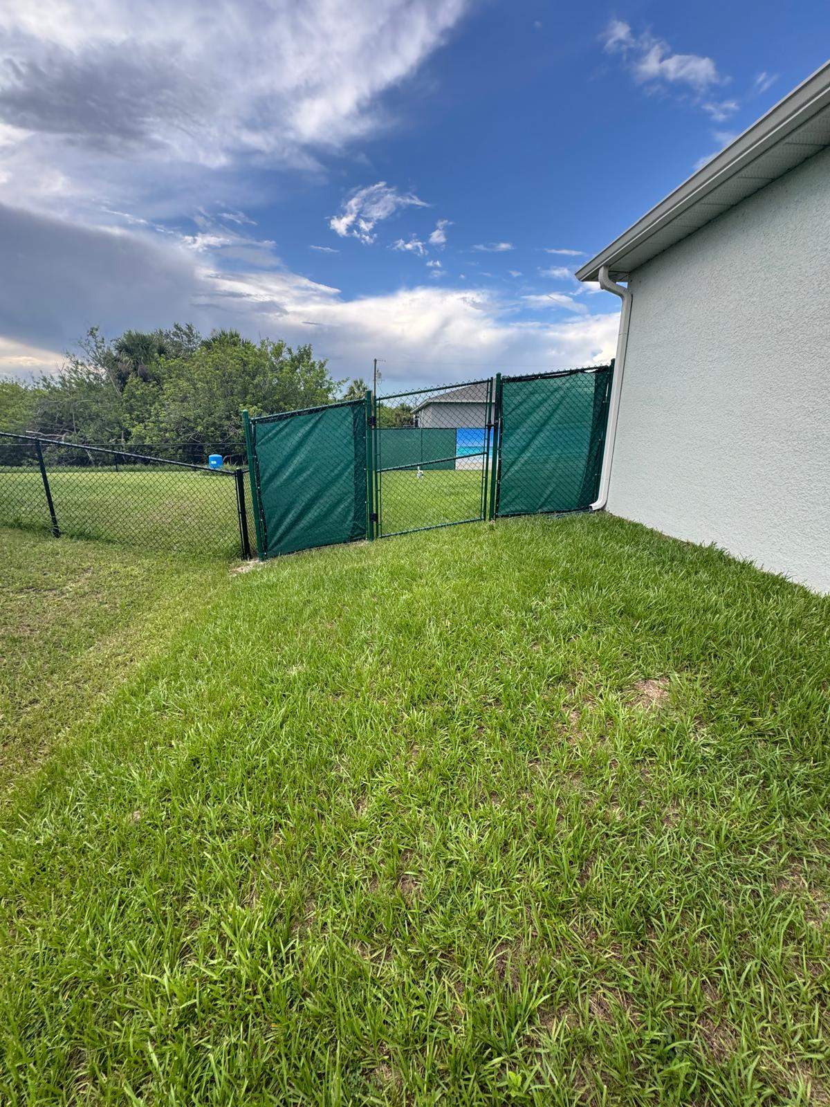Chain Link Fence Installation with Custom Beach Privacy Screen in Port Charlotte by True Fence LLC