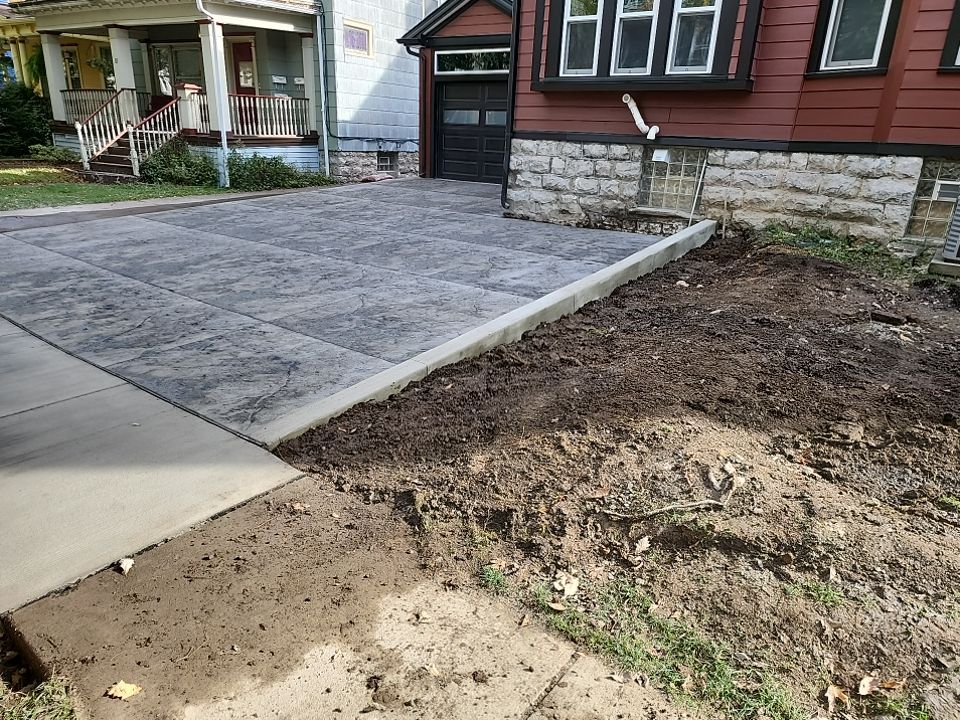 Exterior Renovations- Siding, Stamped Concrete, Porch, and Railings by Ivy Lea Construction