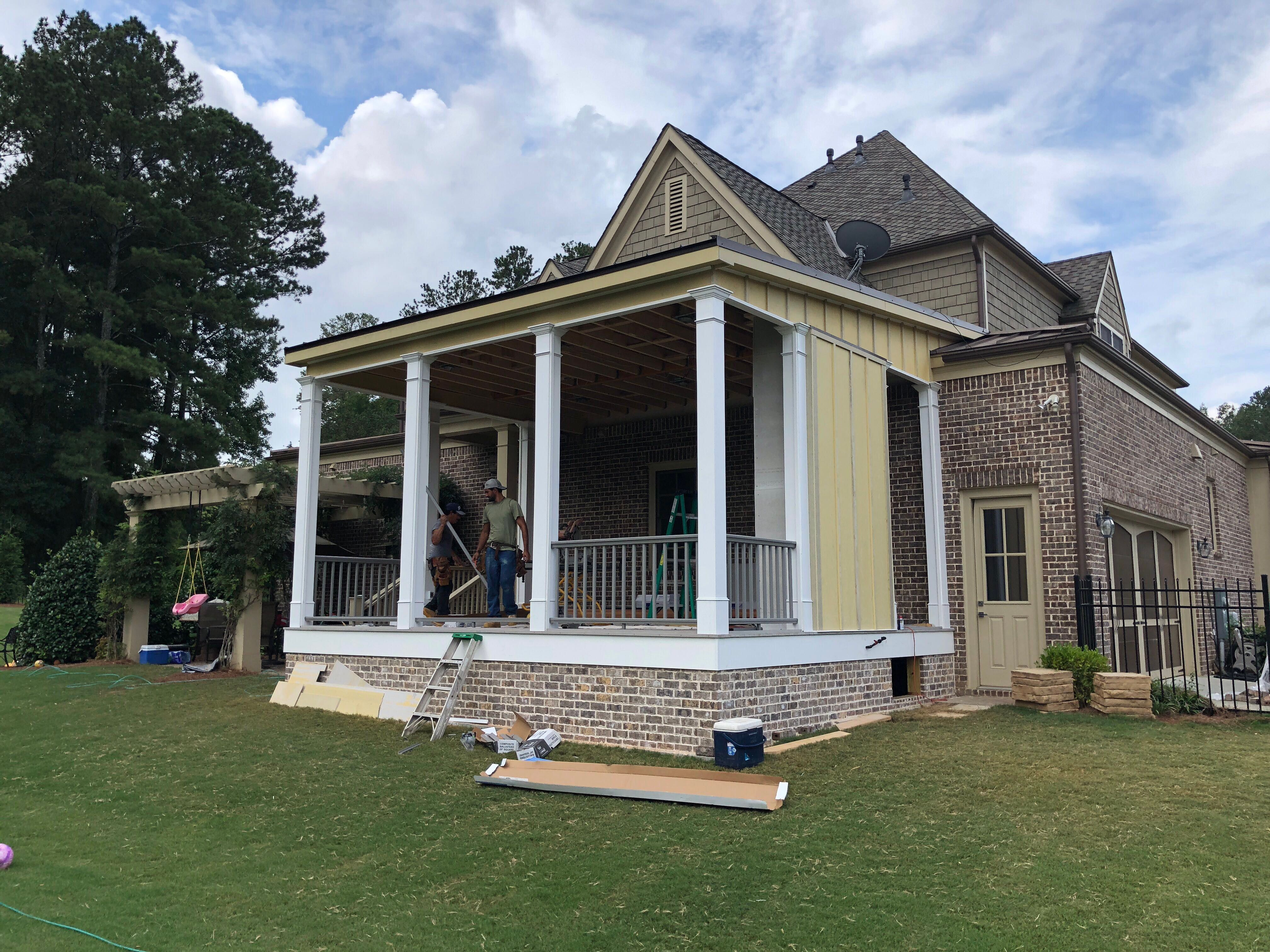 Custom Screened Porch Addition with White Brick Fireplace in Duluth by Swift Home Renovations