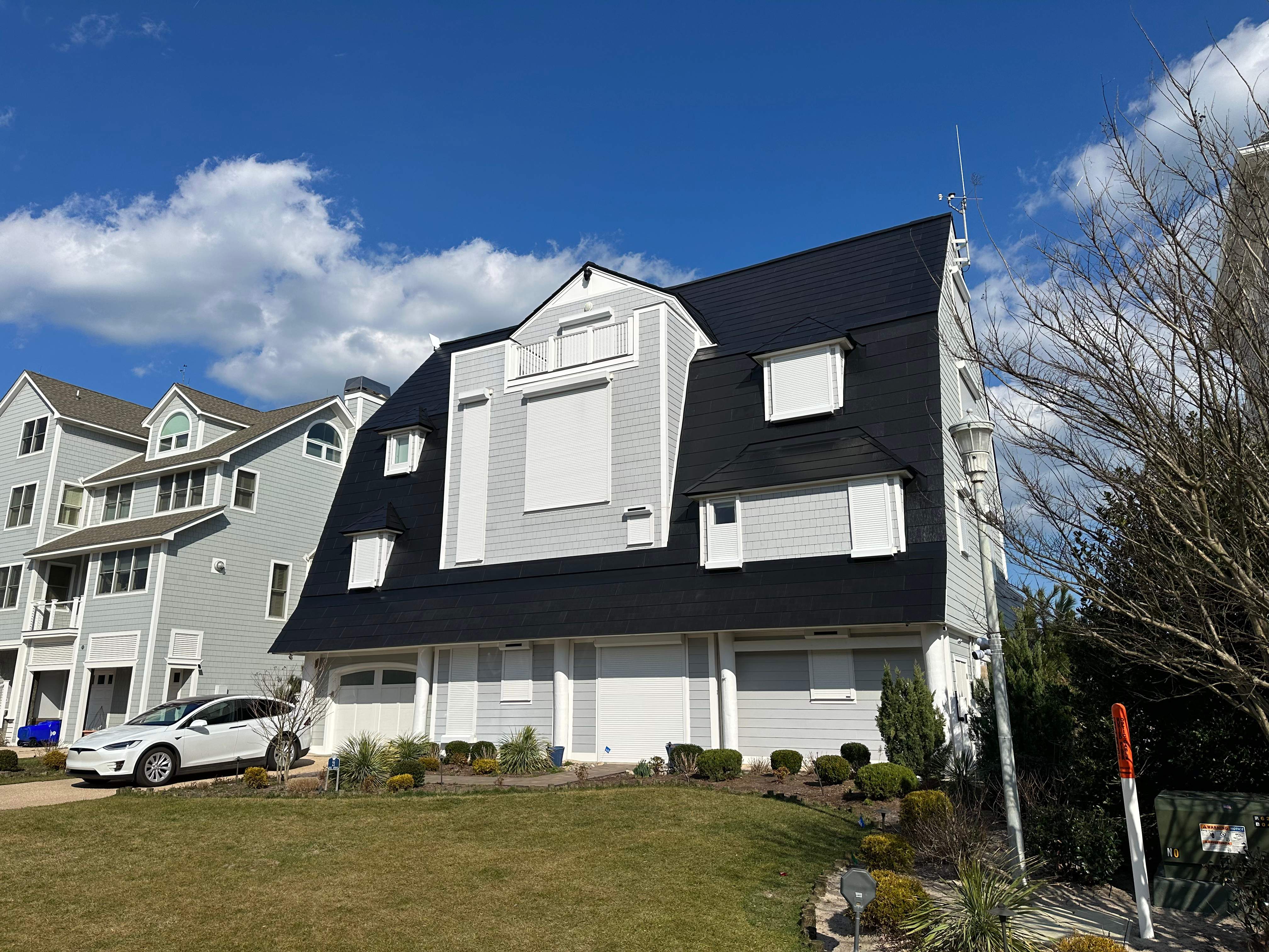 World's Steepest Tesla Solar Roof! by American Home Contractors