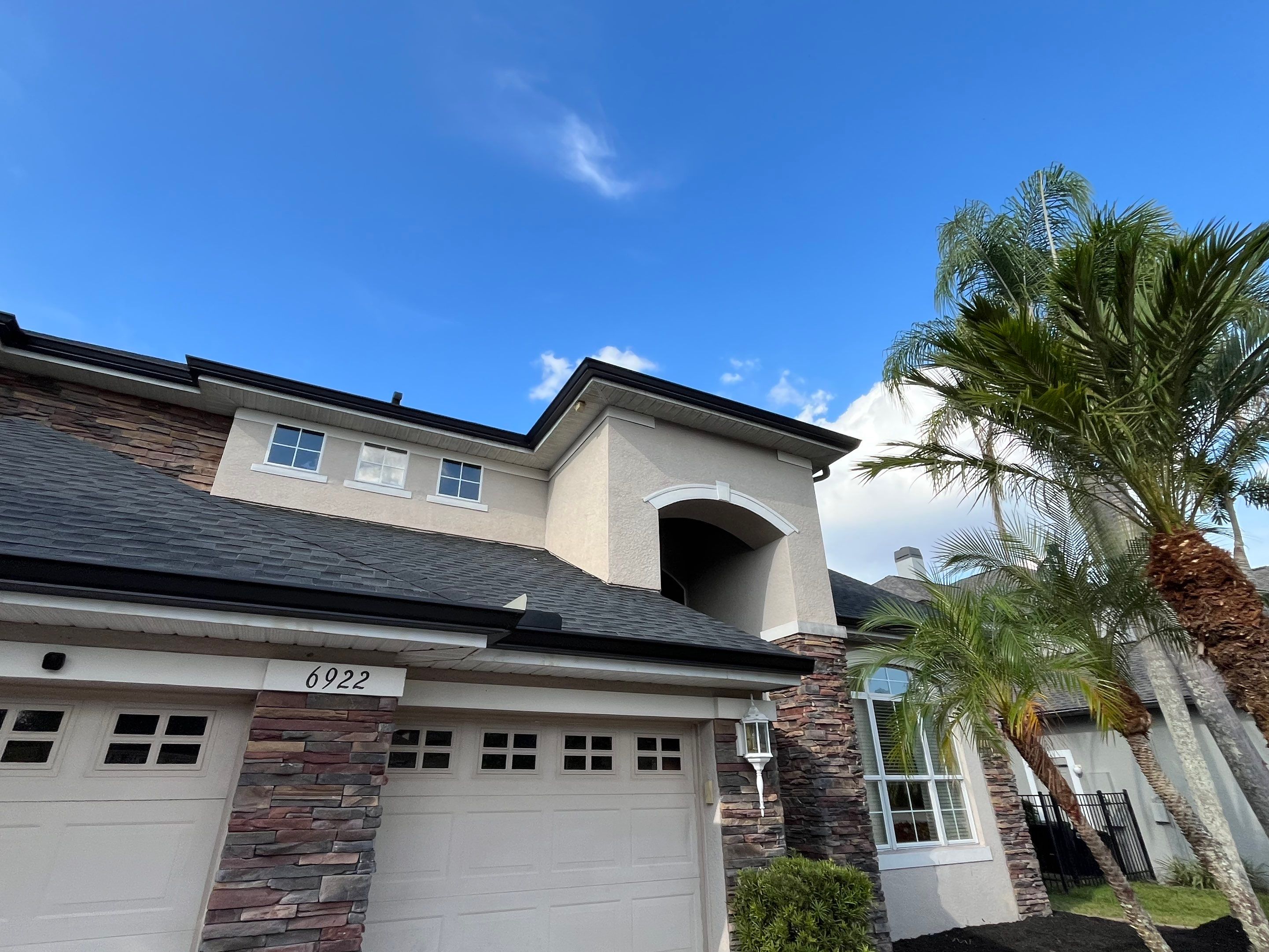 Black 6-inch Seamless Gutters for Modern Ellenton Homes FL by Gutter Professors