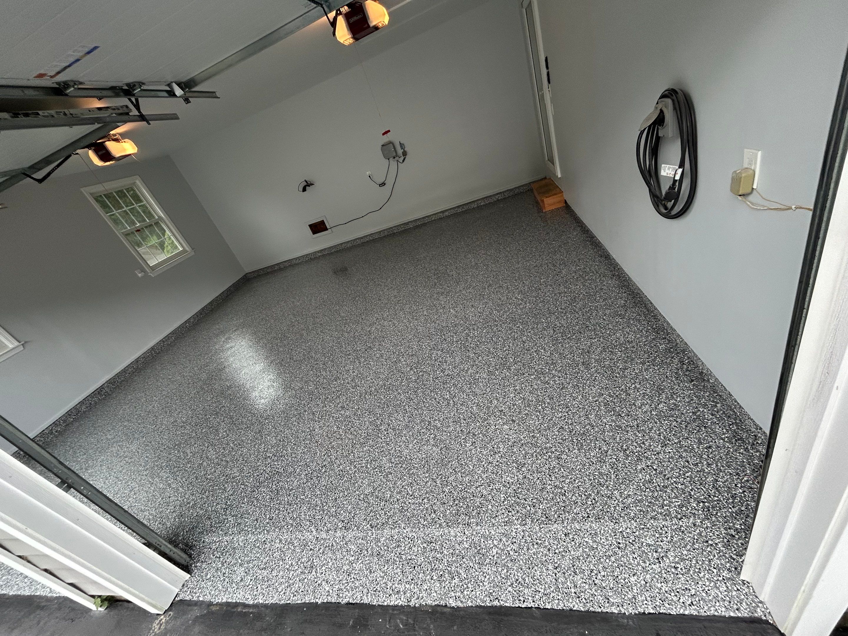 Wombat Concrete Floor Coating Transformation by DiGiorgi Roofing and Siding Inc