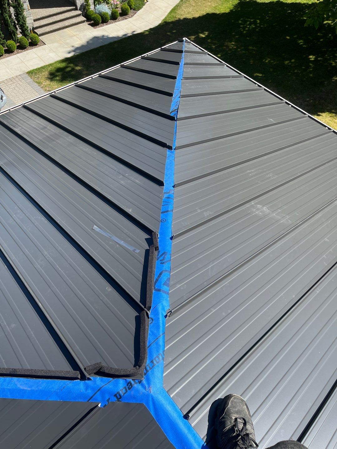 Residential Roofing Installation using 12" Prolok metal  by Top Notch Roofing Inc