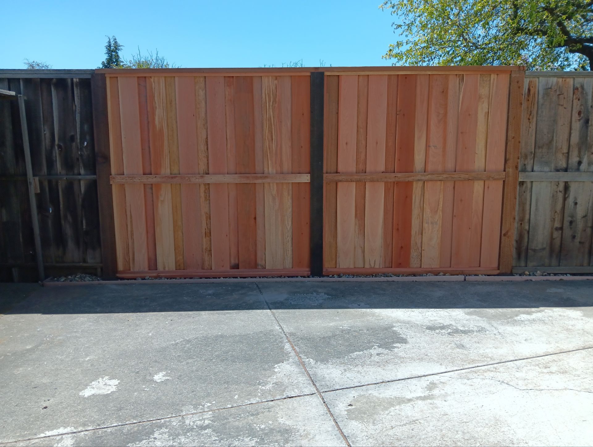 Board on Board with 1' Triple Lattice - 8' / 6' High by Fremont Fence Inc