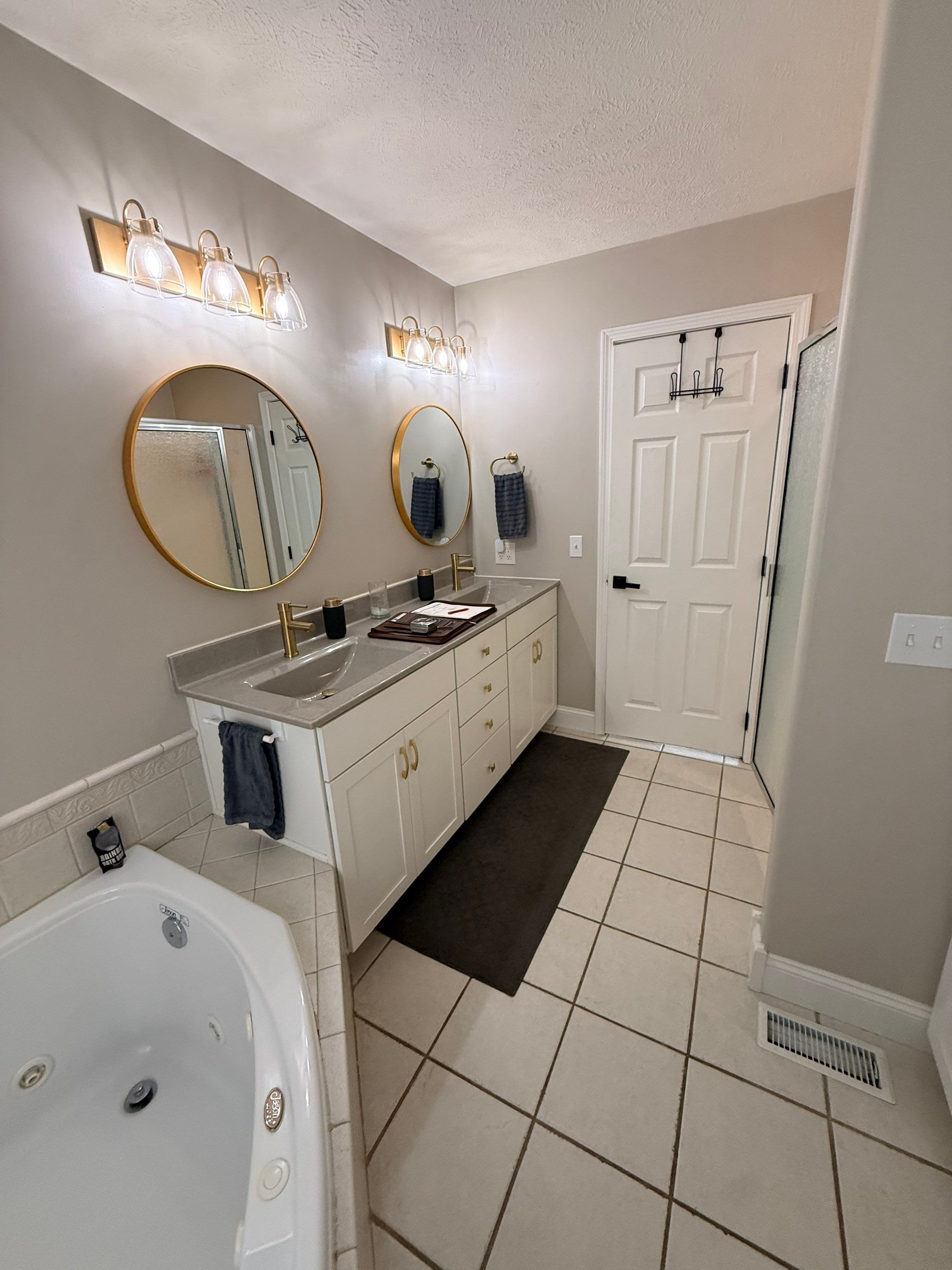 Master Bathroom Renovation Featuring Dark Textured Shower Panels in Branson West by Kitchen Works LLC