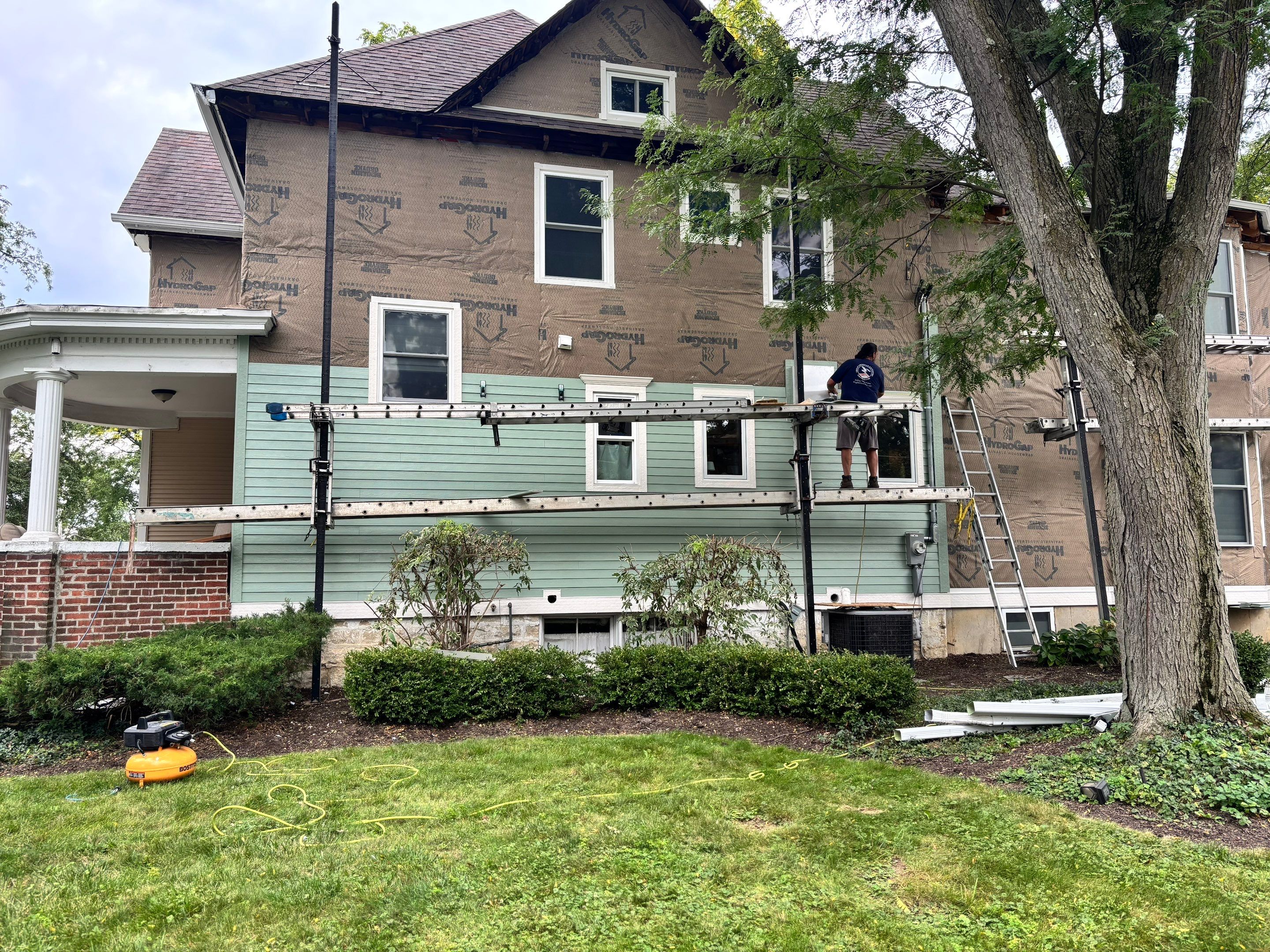 Glen Ellyn Exterior Renovation Featuring James Hardie Siding and Porch Restoration by Great American Exteriors
