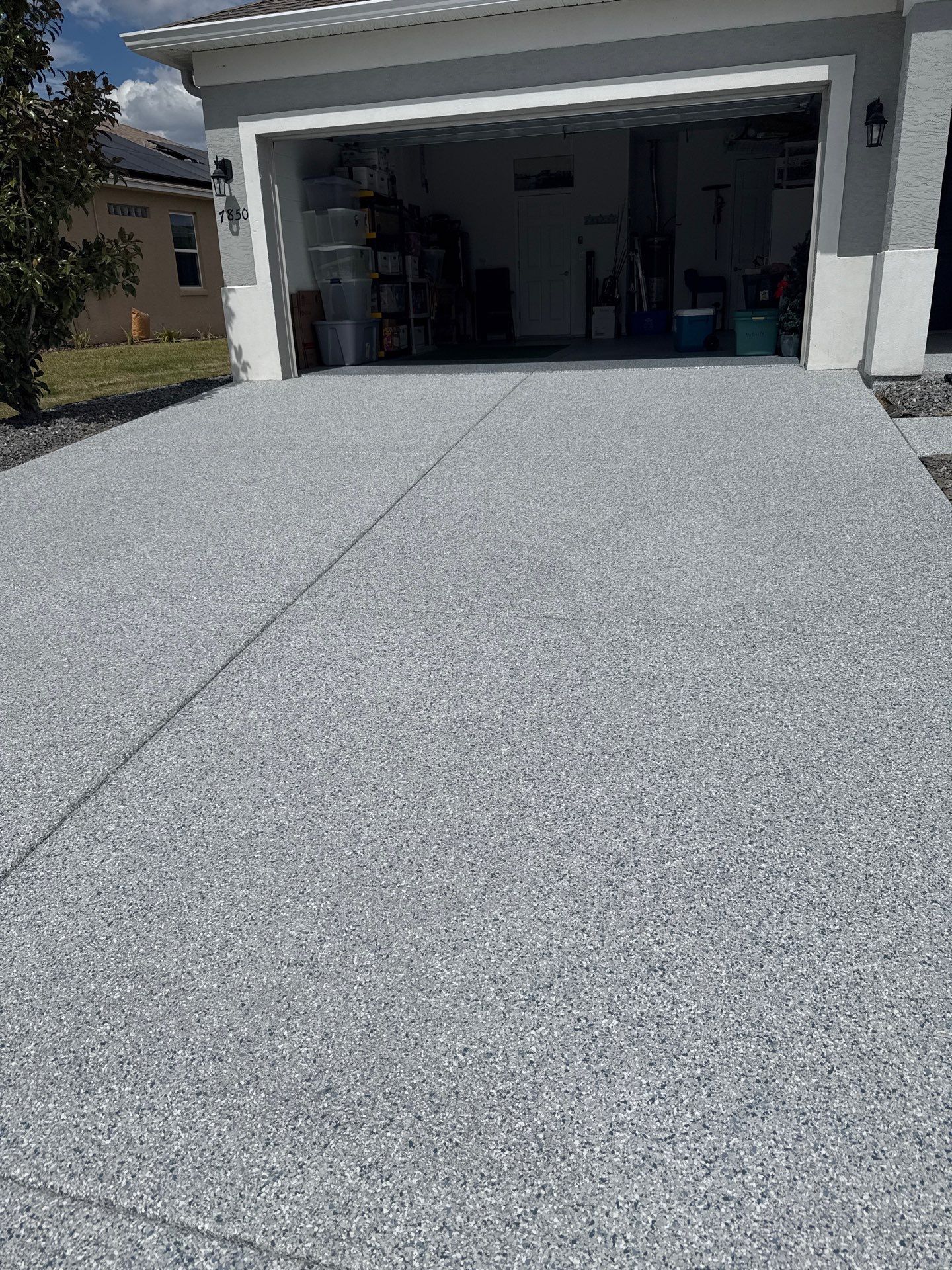 Driveway with Border Slatestone  by Innovative Concrete Coatings 