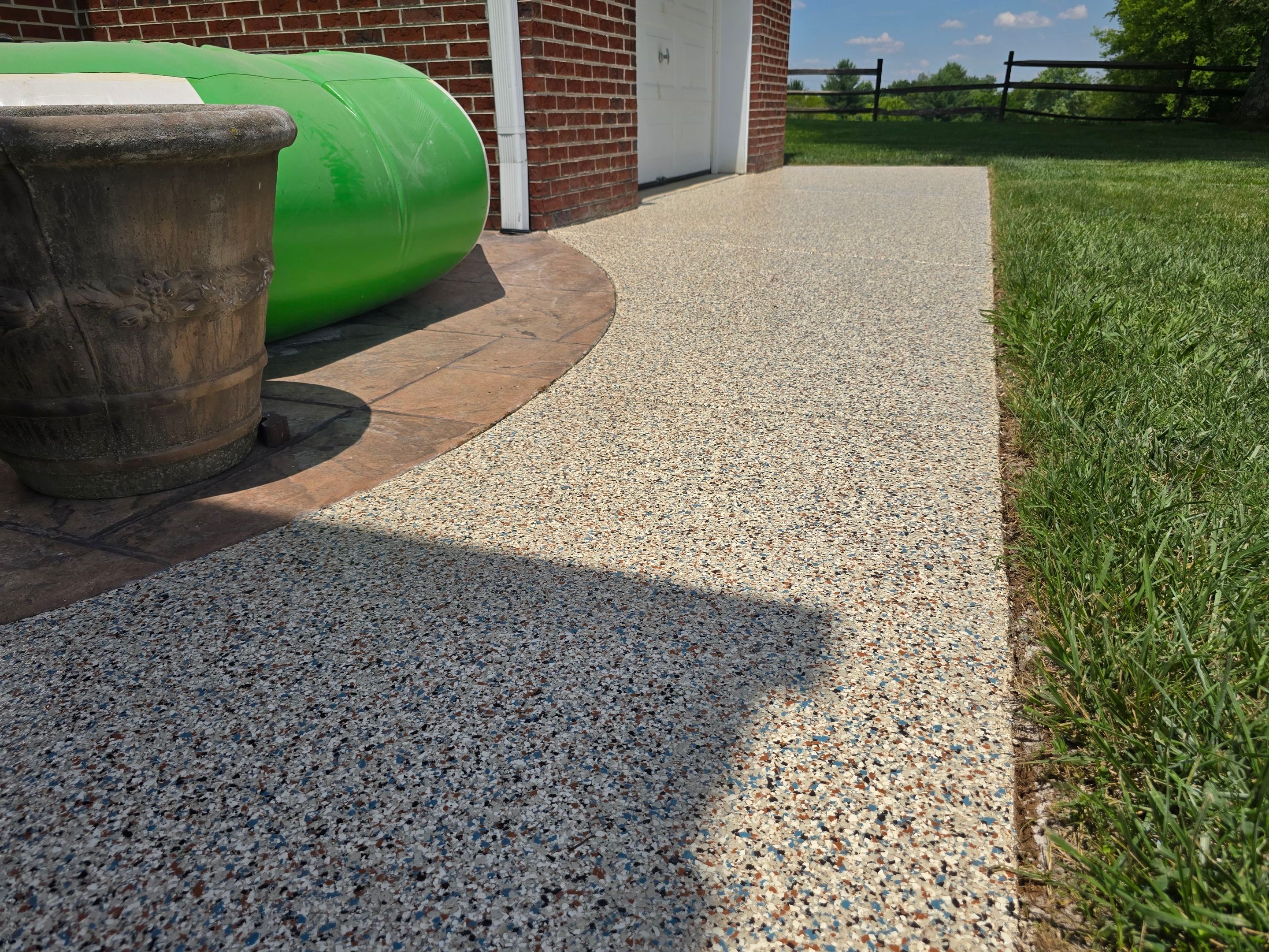 Pool Deck and Porch Using Brownstone and Coldwater Canyon by Elite Floor Solutions