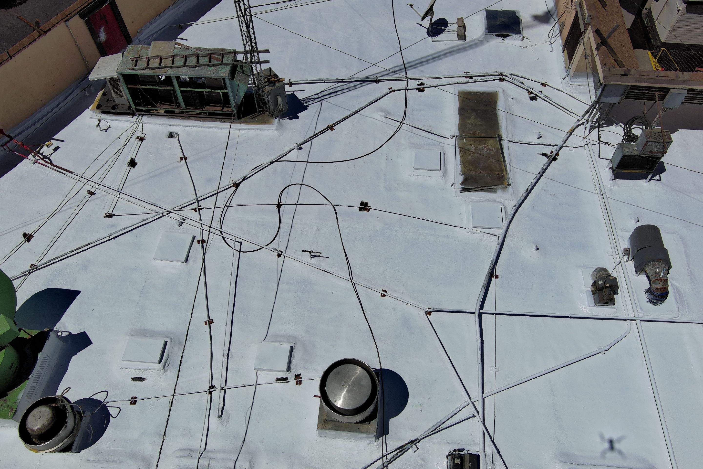 Spray foam and coatings using General Coatings acrylic coatings and spray foam by Straight Edge Roofing Inc