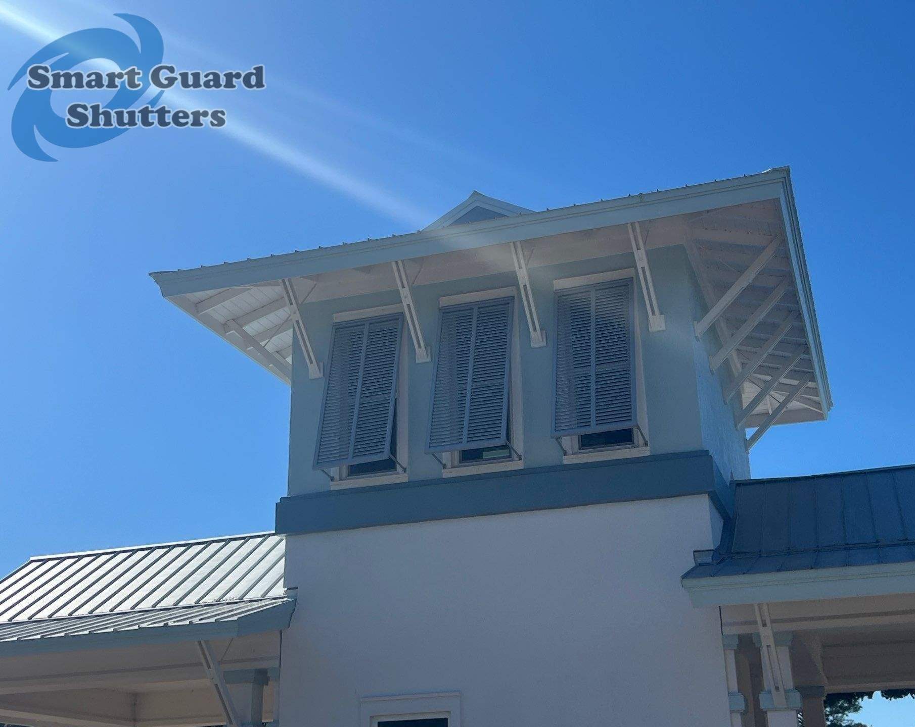 Decorative Bahama Shutters in Window Grey by Smart Guard Shutters
