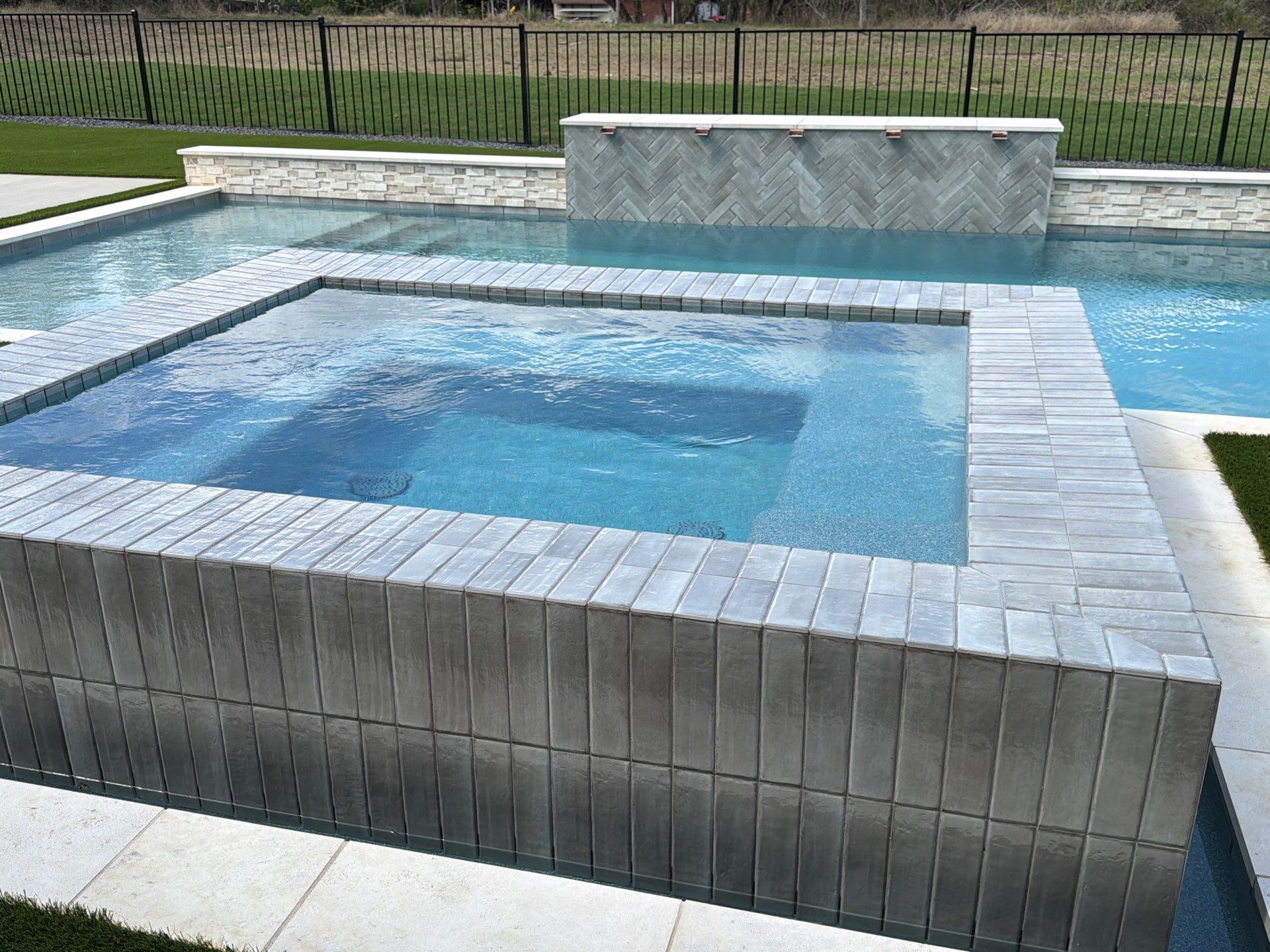 Modern Geometric Pool with Raised Spa and Tanning Ledge by Pinnacle Pools and Spas - DFW