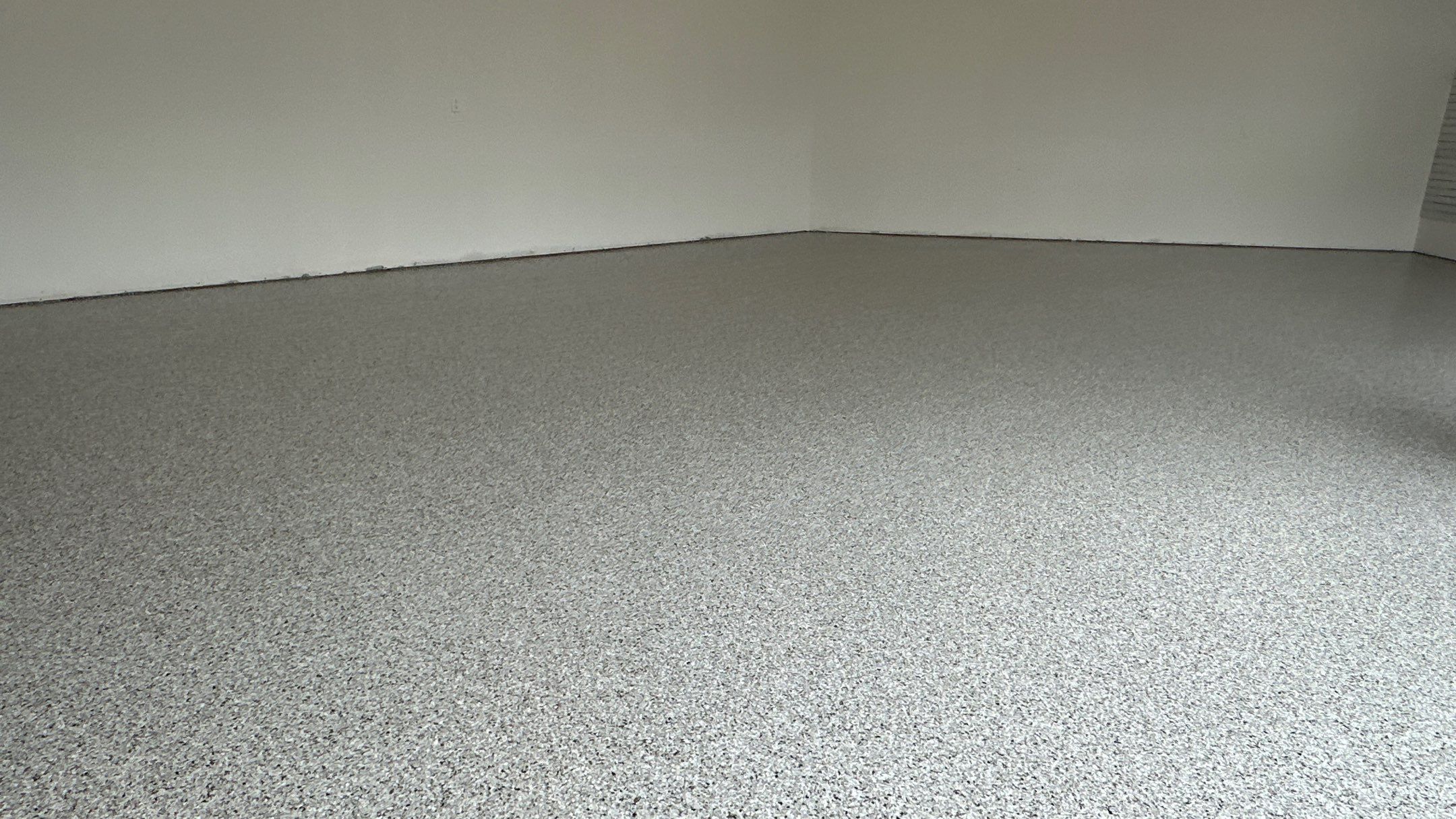 Jon S. transformed his garage with a new floor, slotwall & Cabinets! by Banner Garage