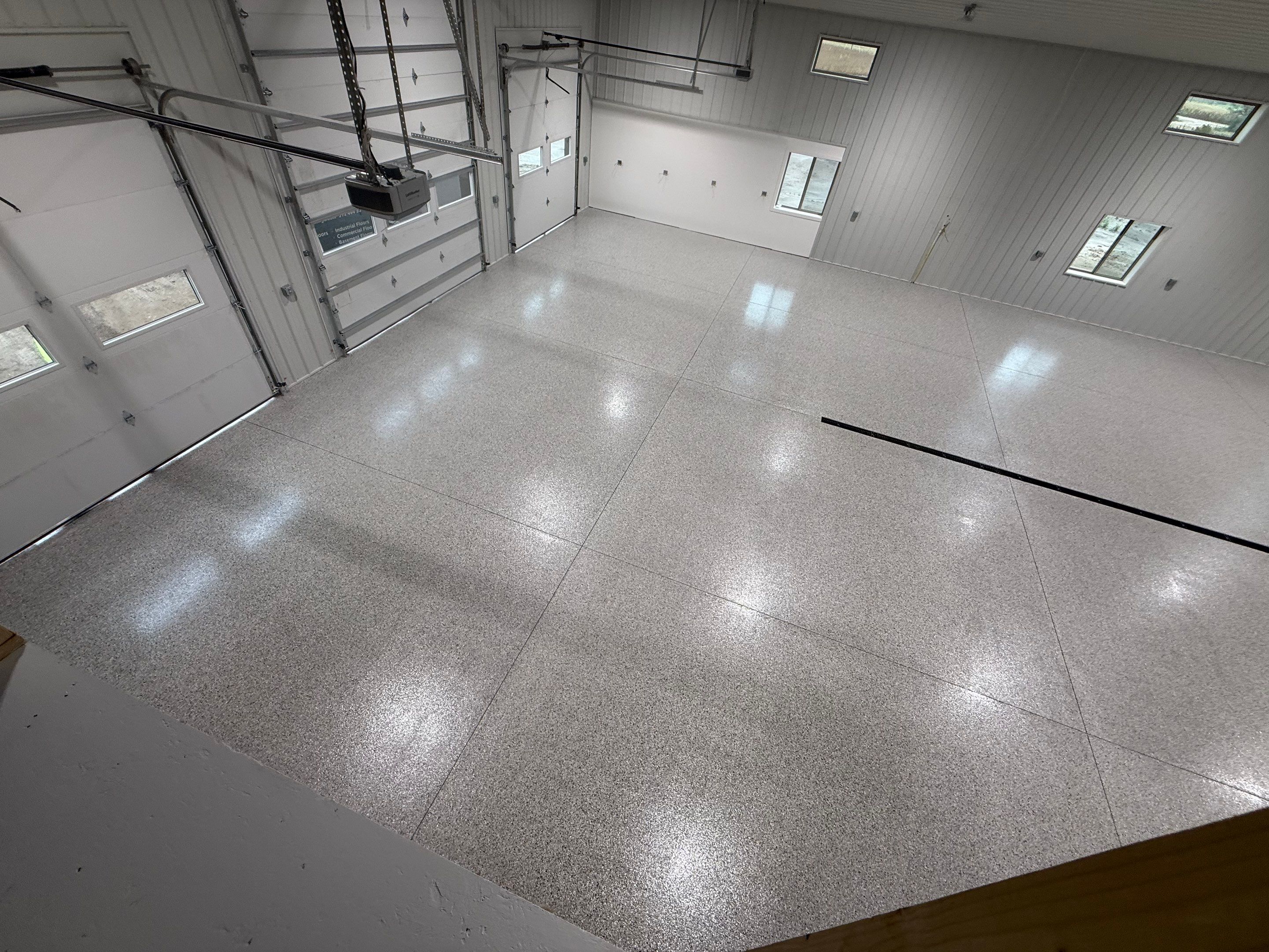 Custom Speckled Floor Coating for Large Montrose Shop by Select Painting, Coatings & Garage Cabinets