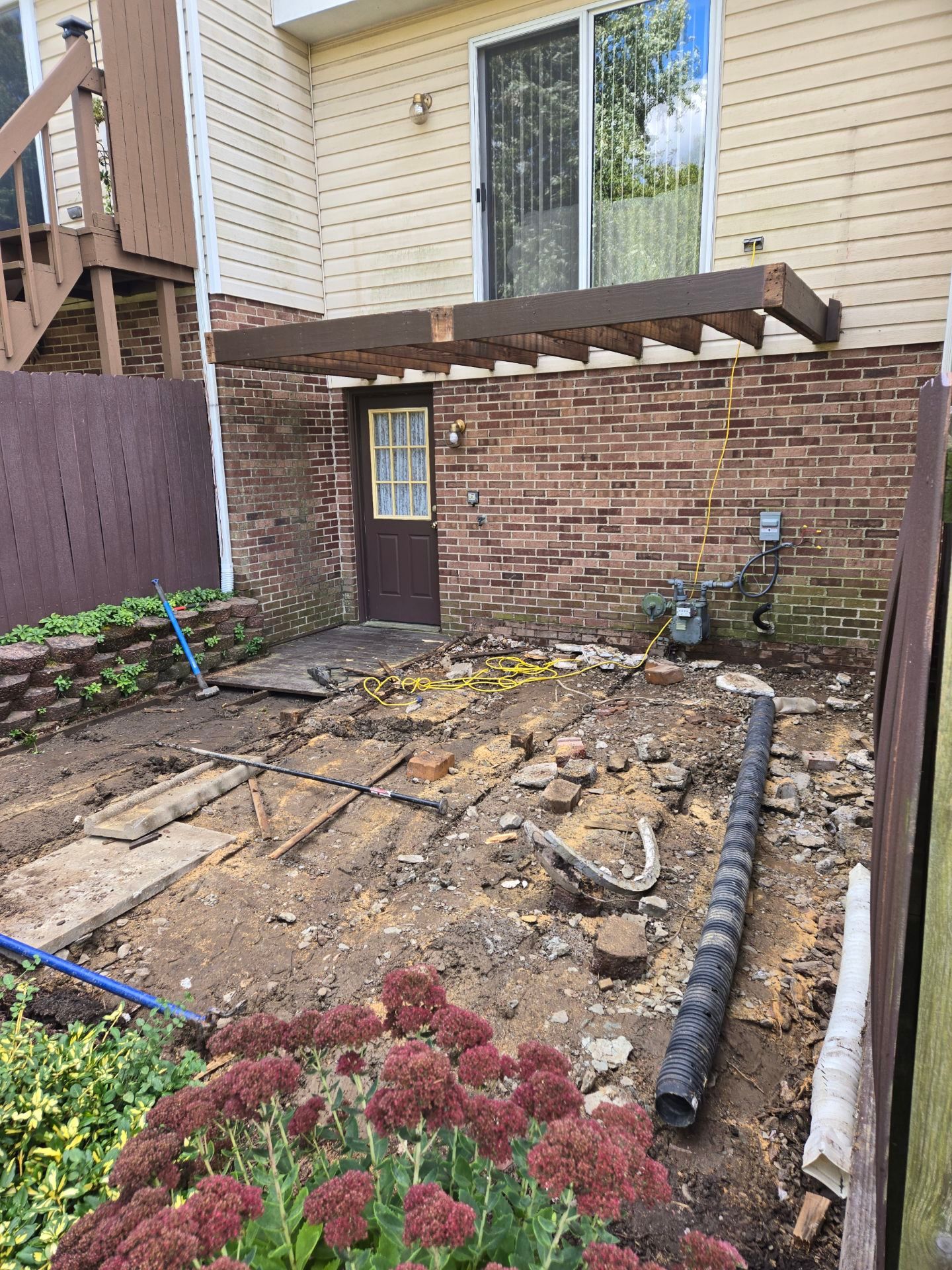Stamped concrete and redeck  by Cousins Roofing Siding & Decks
