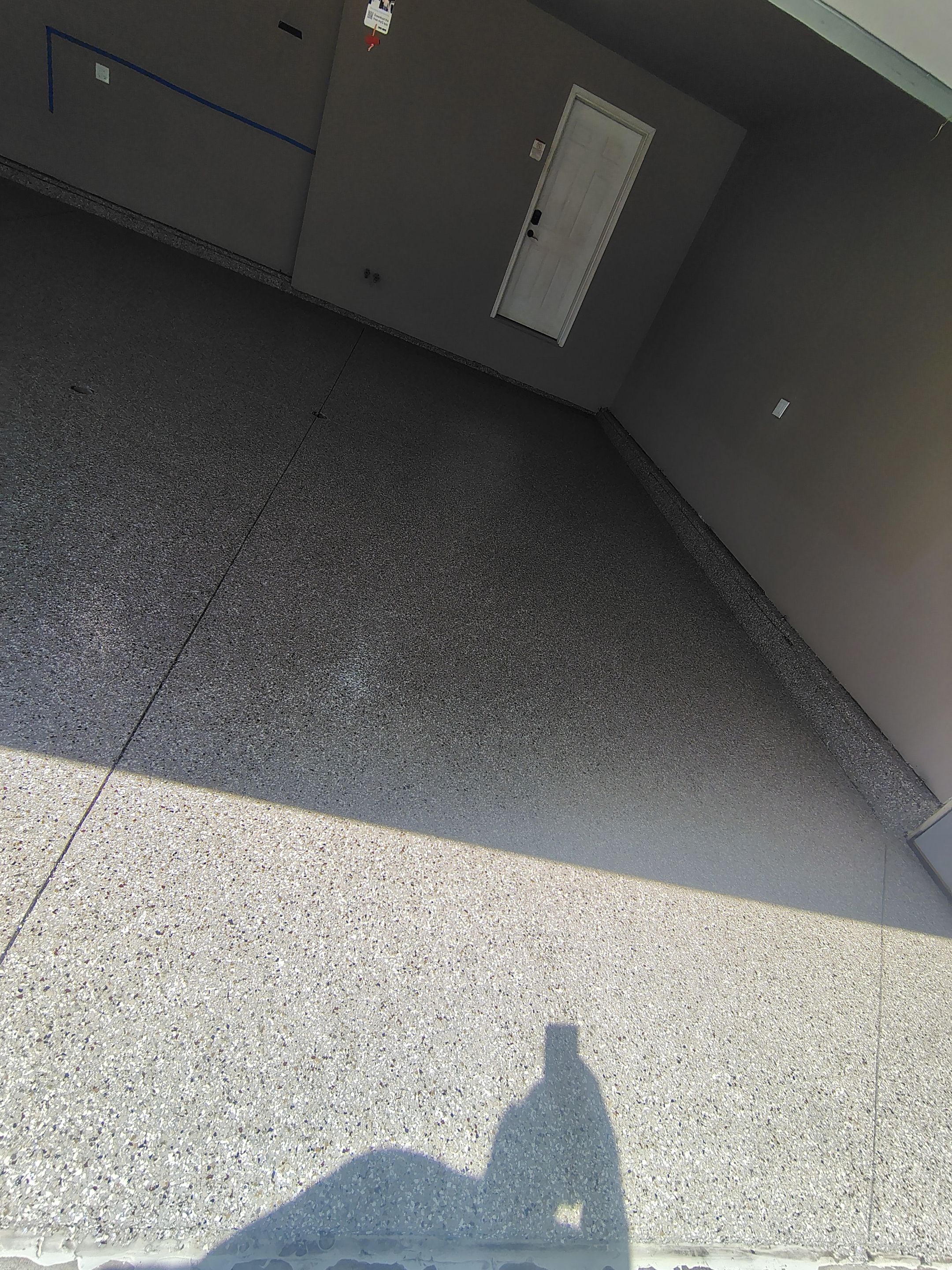 Sioux Falls Garage Concrete Repair and Epoxy Flake Floor Coating by Select Painting, Coatings & Garage Cabinets