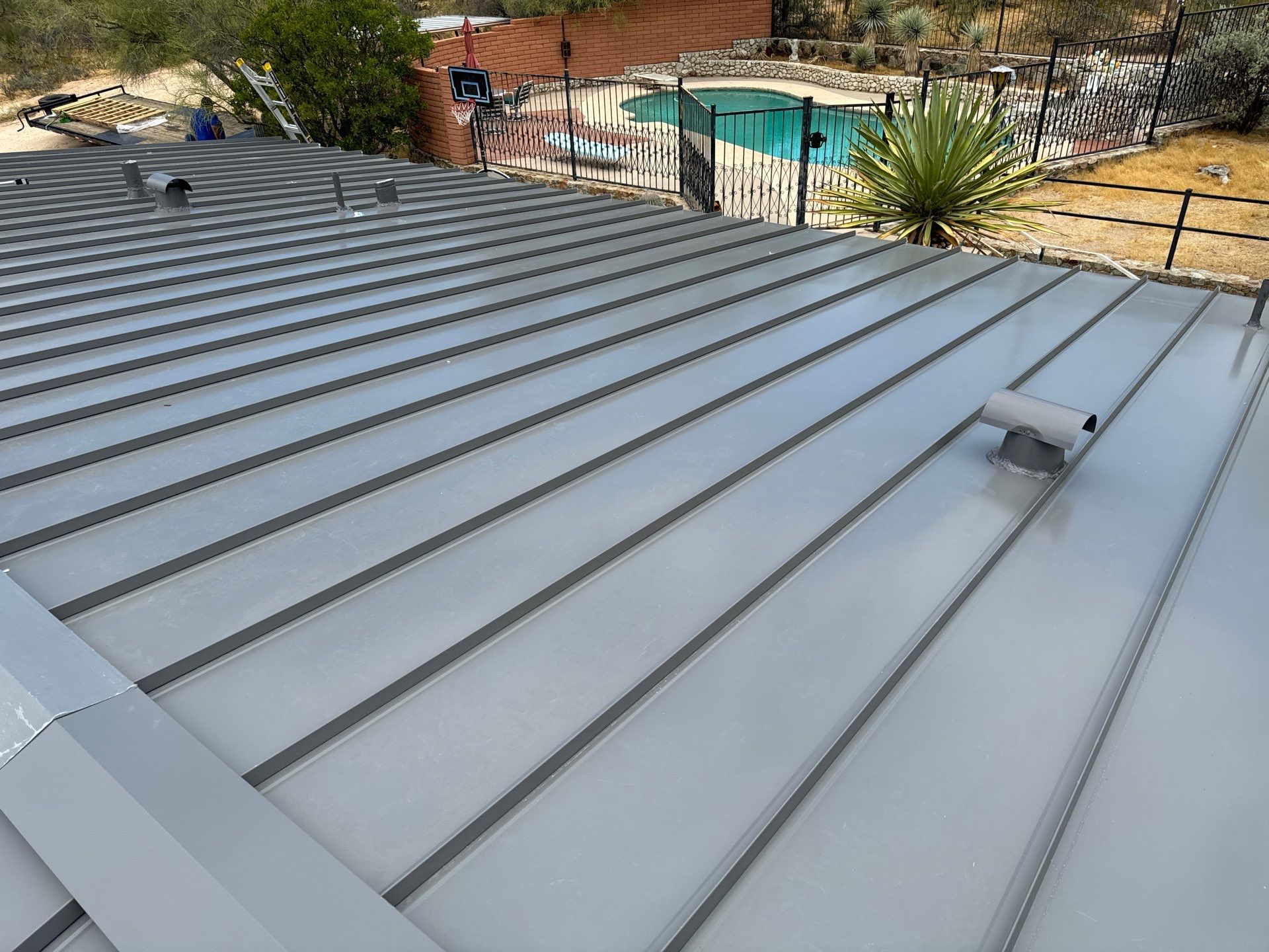 Charcoal Gray Standing Seam by Reimagine Roofing