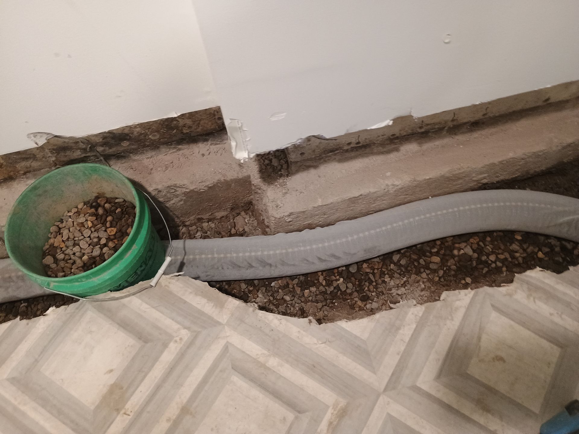 Interior Drain Tile & Buried Discharge in St. Anthony, MN by Waterproofing Northeast