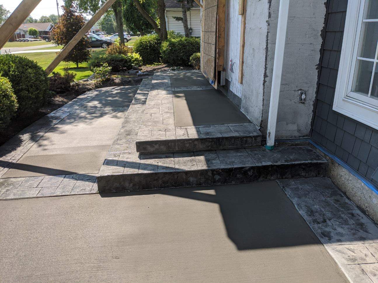 Exterior Renovations- Siding, Concrete, Railings, and Entry Door  by Ivy Lea Construction