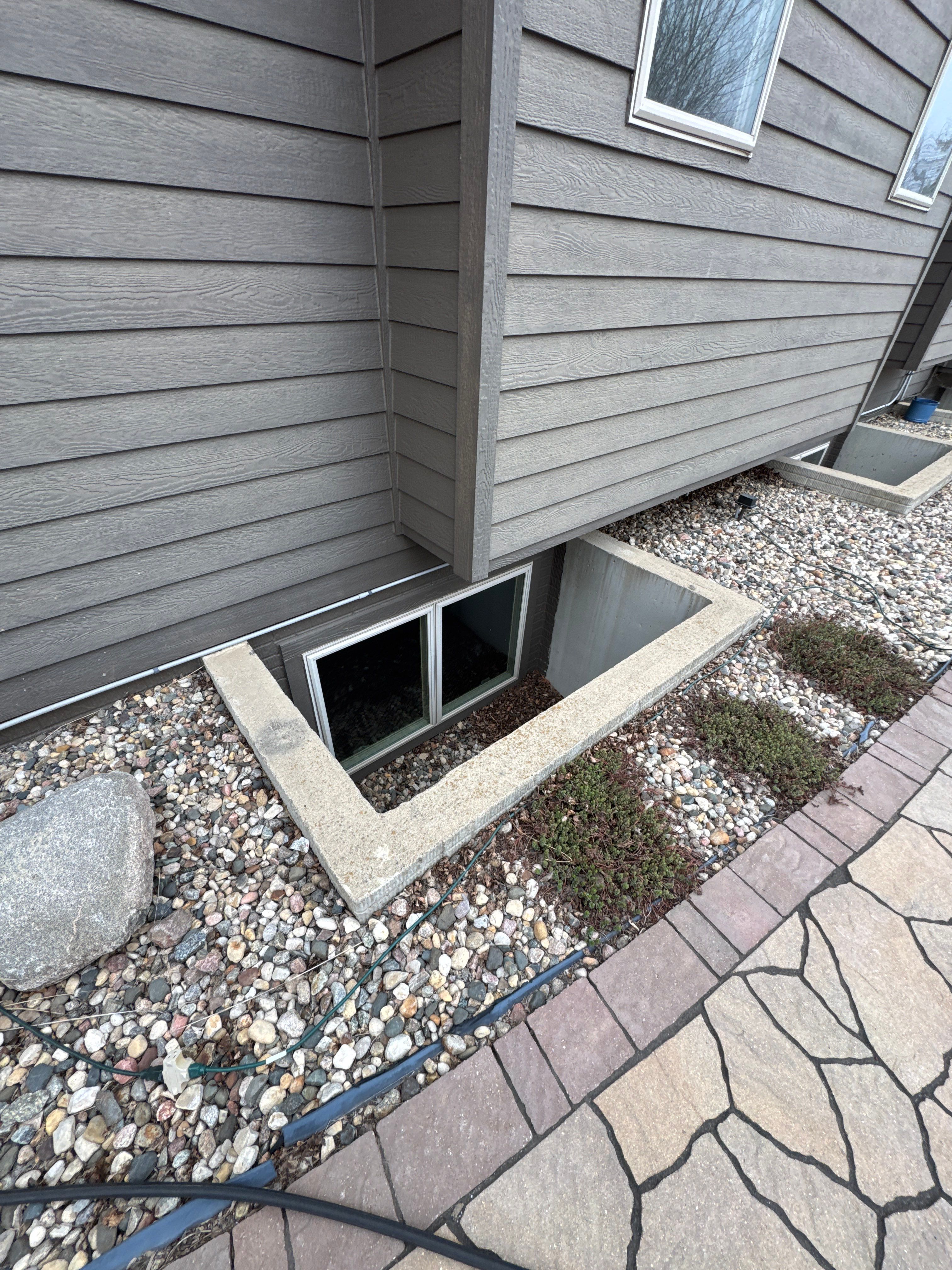 Sioux Falls Residential Exterior Update and Flagstone Pool Deck by Select Painting, Coatings & Garage Cabinets