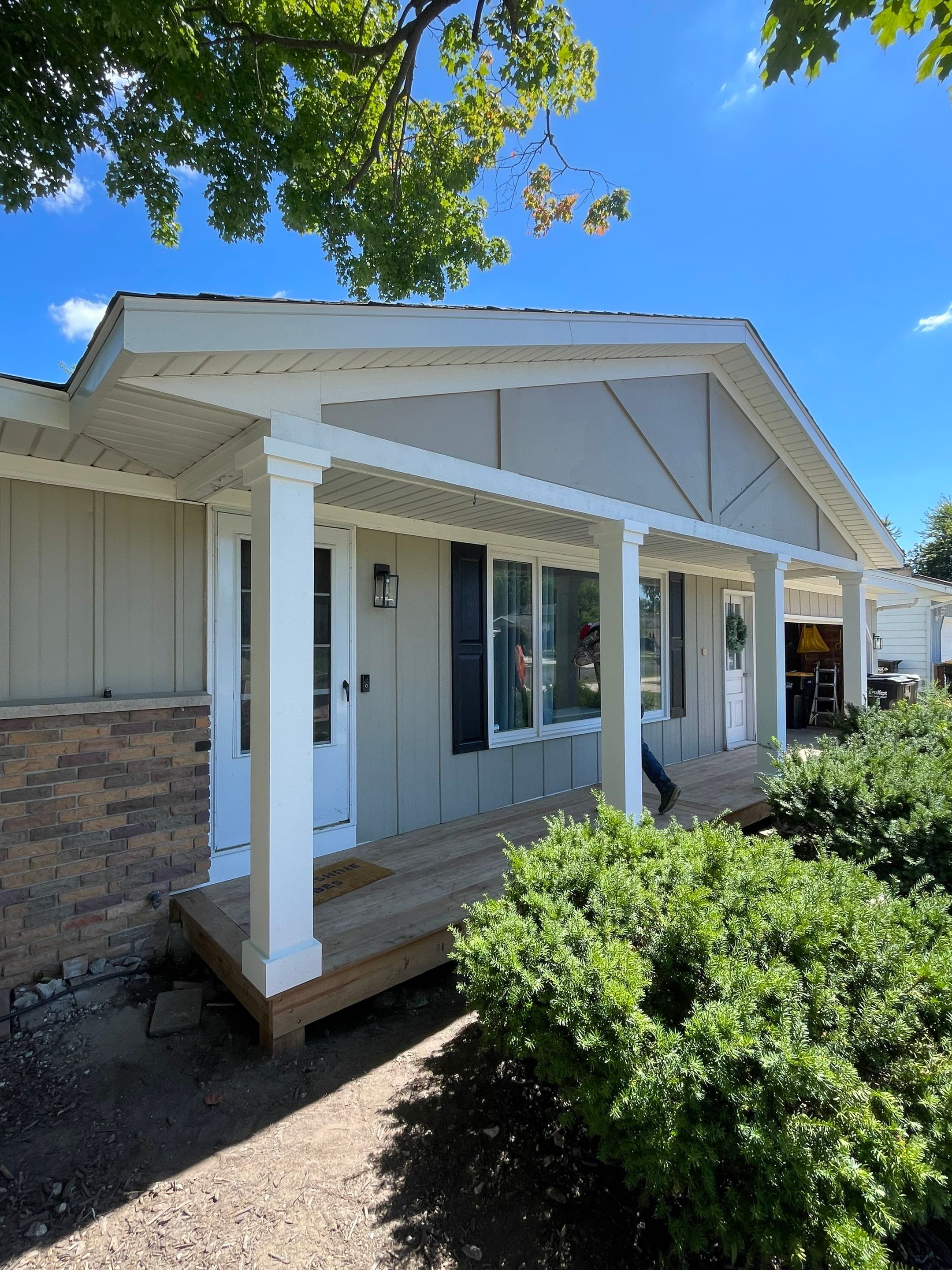 Front Porch Posts and Treated Porch Floor and Steps by Avalon Roofing and Exteriors
