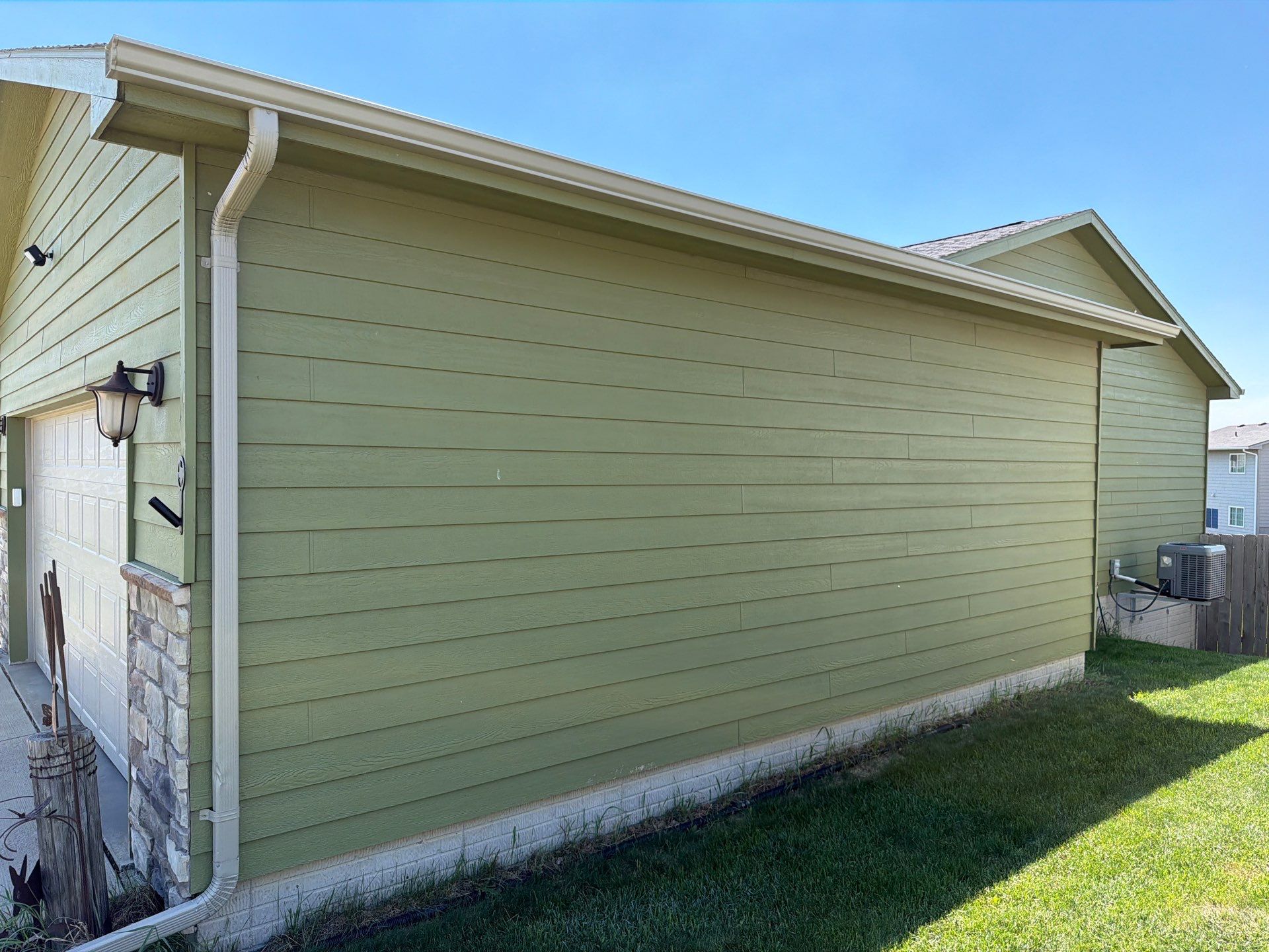 Exterior Painting and Custom Deck Construction in Sioux Falls by Select Painting, Coatings & Garage Cabinets